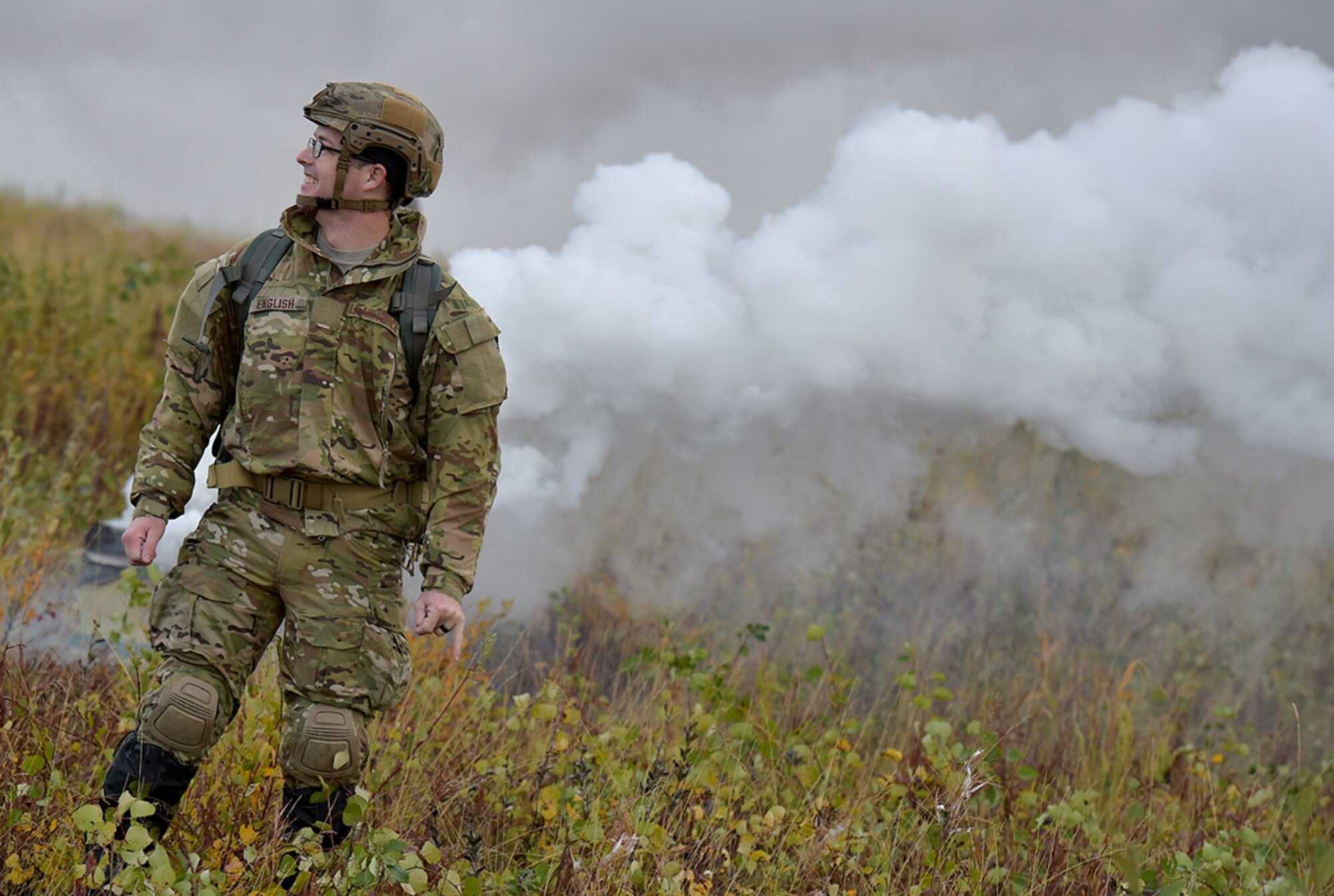 A U.S. Air Force Airman watches Soldiers assigned to U.S. Army Alaska conduct an airborne operation with USARAK Commanding General Army Maj. Gen. Bryan Owens from CH-47 Chinook helicopters over Malemute drop zone on Joint Base Elmendorf-Richardson, Alaska, Sept. 10, 2015.  USARAK is a central component to the Army’s rebalance to the Pacific, providing two fully mission-ready Brigade Combat Teams ready to position unit elements anywhere across the Pac-Rim within 18 hours notice, and is uniquely positioned within nine-hours flight time from 90 percent of the world’s most highly-populated regions. (U.S. Air Force photo/Justin Connaher)