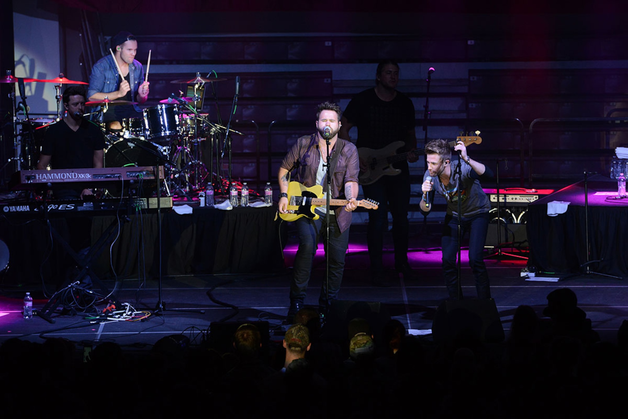 The Swon Brothers perform for a crowd of service and family members at Buckner Physical Fitness Center Sept. 15 during a USO hosted concert. (U.S. Air Force photos/Airman 1st Class Christopher R. Morales)