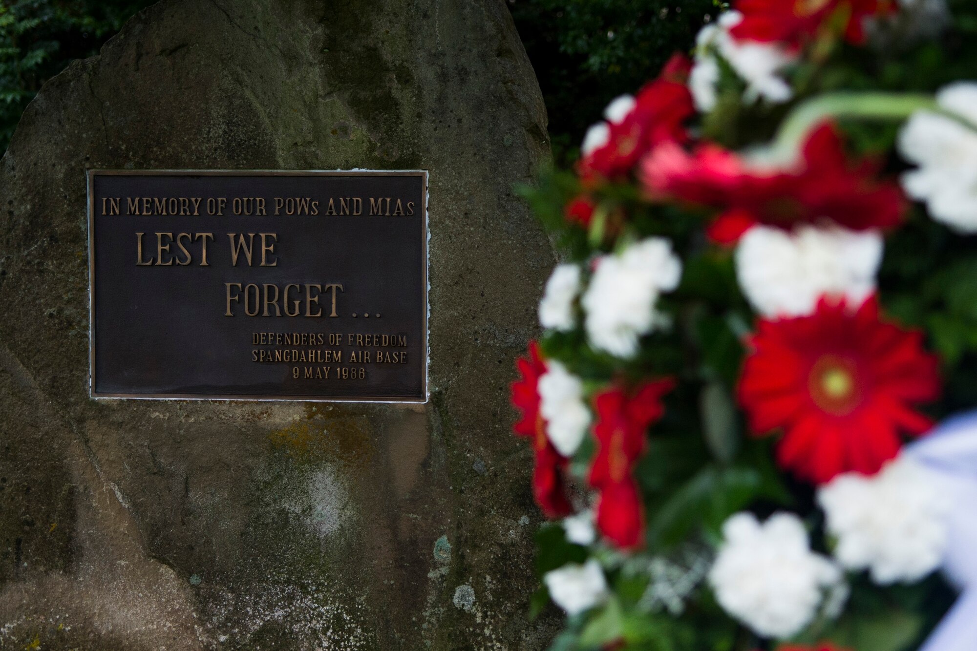 A ceremonial wreath lies next to the prisoners-of-war/missing-in-action memorial at Spangdahlem Air Base, Germany, Sept. 16, 2015. Currently, there are more than 86,000 Americans still unaccounted for. Sept. 18 marks the national POW/MIA Remembrance Day. (U.S. Air Force photo by Airman 1st Class Luke Kitterman/Released)       