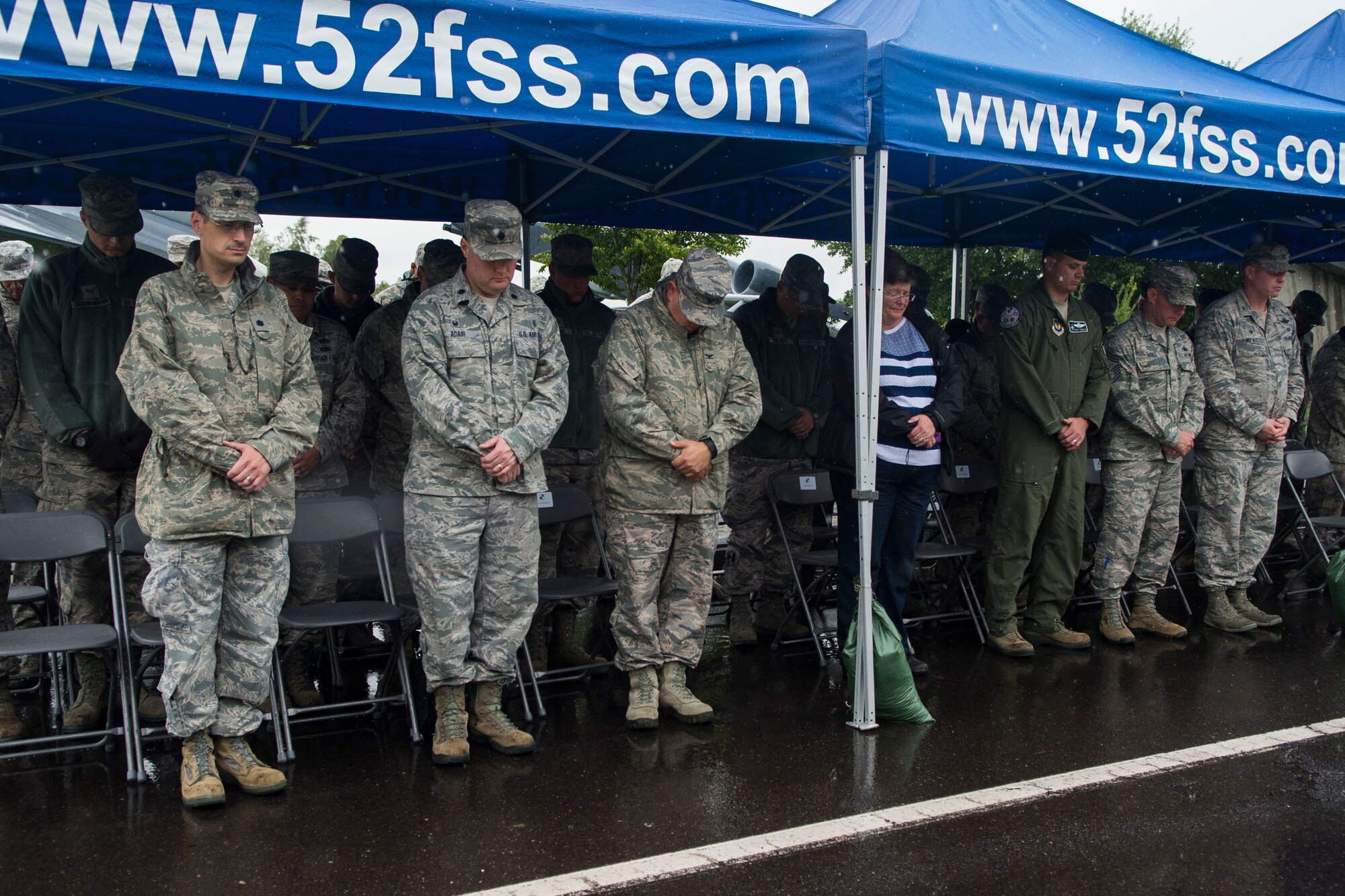 Spangdahlem Airmen and base community members take a moment of silence during a wreath-laying ceremony at the prisoners-of-war/missing-in-action memorial at Spangdahlem Air Base, Germany, Sept. 16, 2015. More than 40 people attended the ceremony. Sept. 18 marks the national POW/MIA Remembrance Day. (U.S. Air Force photo by Airman 1st Class Luke Kitterman/Released)    