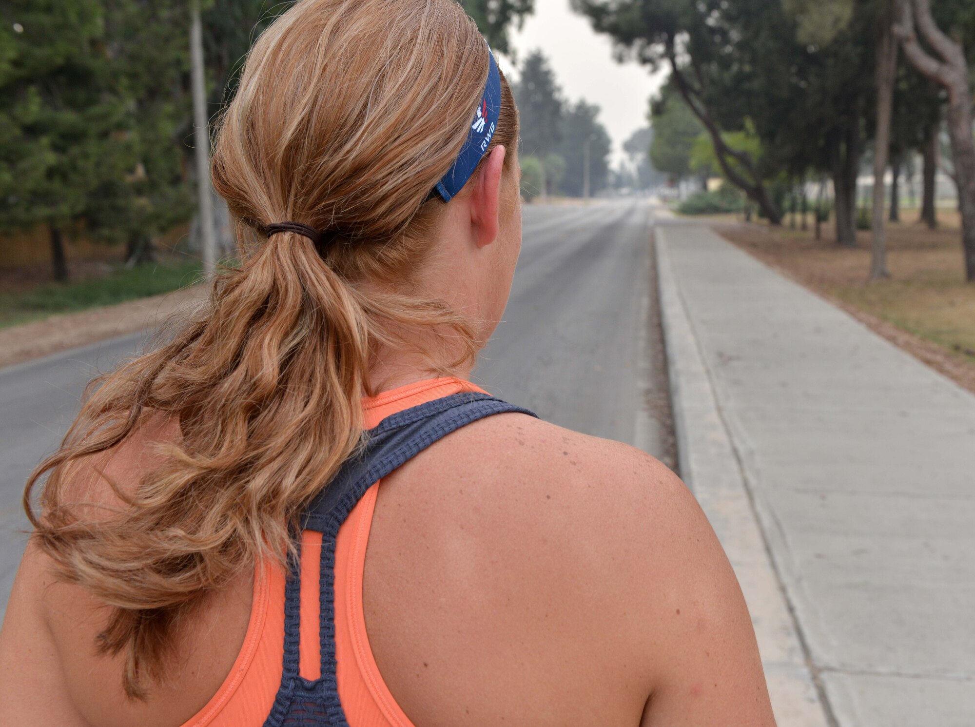 Senior Airman Mary Tarasiewicz, 39th Security Forces Squadron unit deployment manager, prepares for a training run Sept. 9, 2015, at Incirlik Air Base, Turkey. Each week, Tarasiewicz runs more than 30 miles in preparation for the 2015 Air Force Marathon. (U.S. Air Force photo by Senior Airman Michael Battles/Released) 