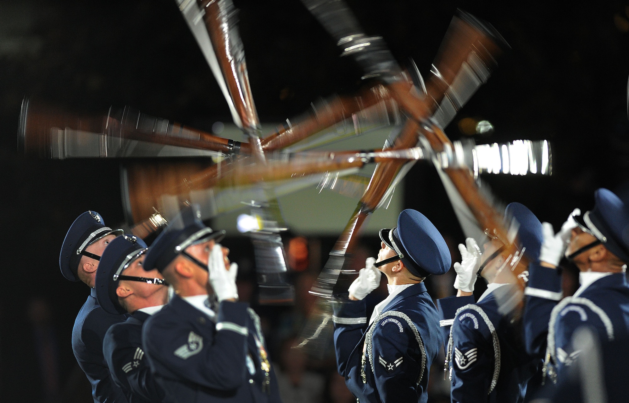 The United States Air Force Honor Guard Drill Team performs during the United States Air Force Tattoo on Sept. 17, 2015. The Air Force District of Washington commemorated the United States Air Force's 68th birthday September 17, 2015 with a celebration of music, drill and ceremony, aircraft, and fireworks on the Air Force Ceremonial Lawn at Joint Base Anacostia-Bolling. The event included flyovers of several aircraft that included the Air Force Thunderbirds and a Warbird vintage aircraft squadron, as well as performances by the Air Force Band and Honor Guard. (U.S. Air Force photo/Jim Lotz)