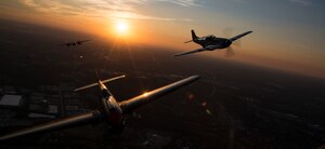 A P-40 Warhawk, P-51 Mustang and a B-25 Mitchell fly over Joint Base Bolling-Anacostia, Washington, D.C., during a Military Tattoo on base Sept. 16, 2015. The “Warbirds flight”, which also consisted of two B-25 Mitchells and two P-40 Warhawks. (U.S. Air Force photo by Airman 1st Class Philip Bryant/Released)
