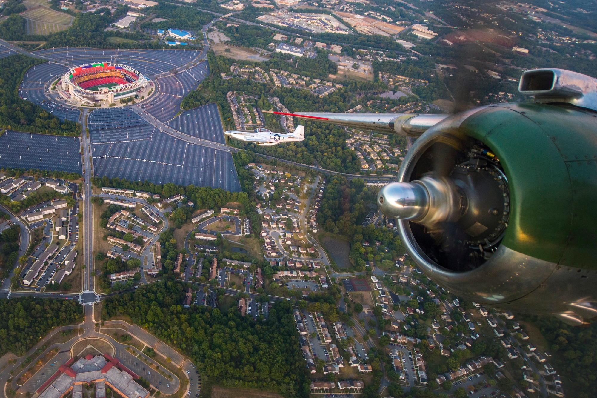 A P-51 Mustang flies over FedEx Field during a Military Tattoo held at Joint Base Anacostia-Bolling, Washington, D.C., Sept. 16, 2015. The P-51 was part of the “Warbird flight,” which also consisted of two B-25 Mitchells and two P-40 Warhawks. (U.S. Air Force photo/Airman 1st Class Ryan J. Sonnier)