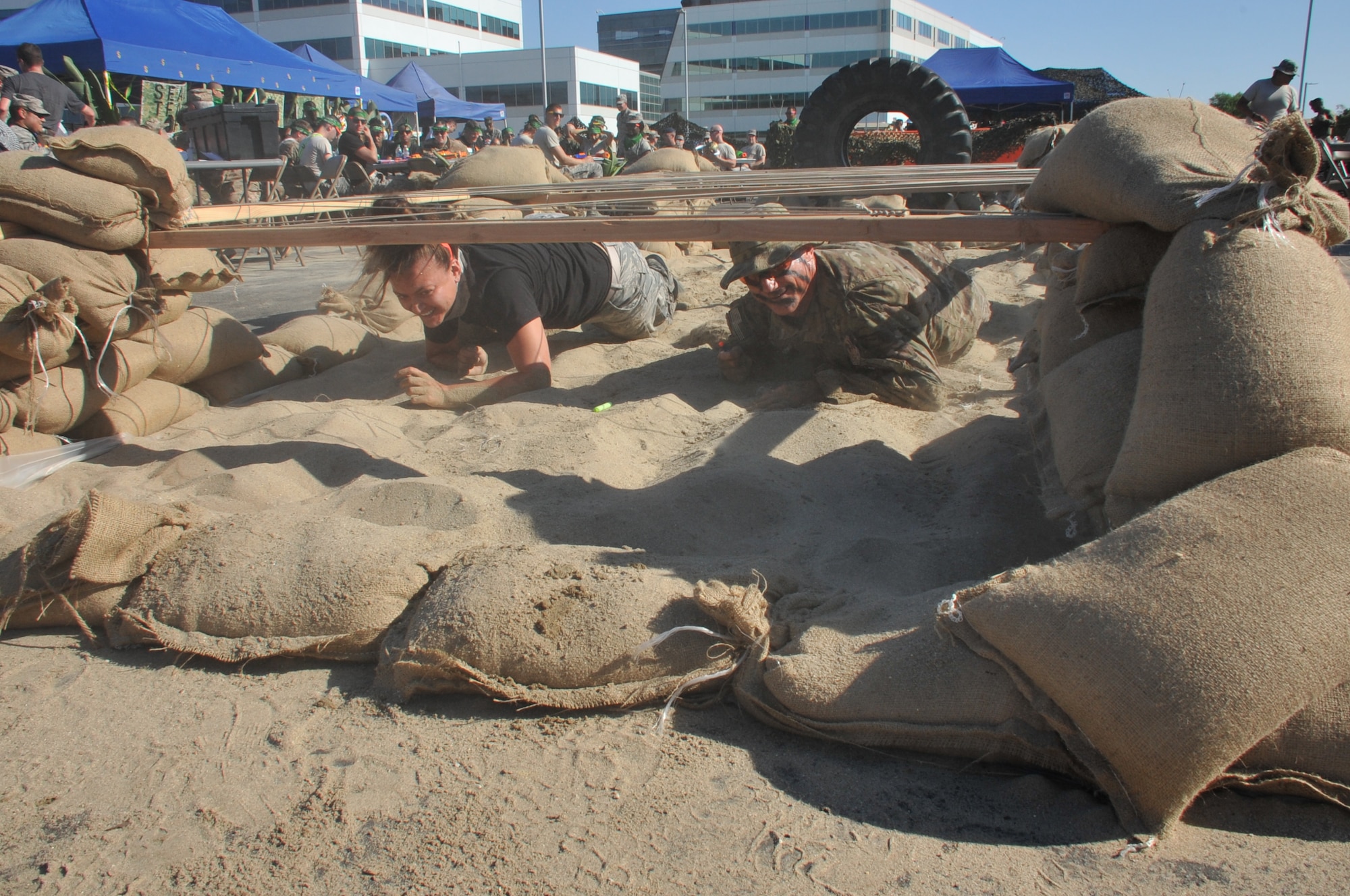 It’s a race to the finish line as Staff Sgt. Bonnie Gheen battles Chief Master Sgt. Craig Hall, Space and Missile Systems Center command chief through an obstacle course during the SMC Dining-Out held at Los Angeles Air Force Base in El Segundo, Calif. (U.S. Air Force photo/Sarah Corrice)