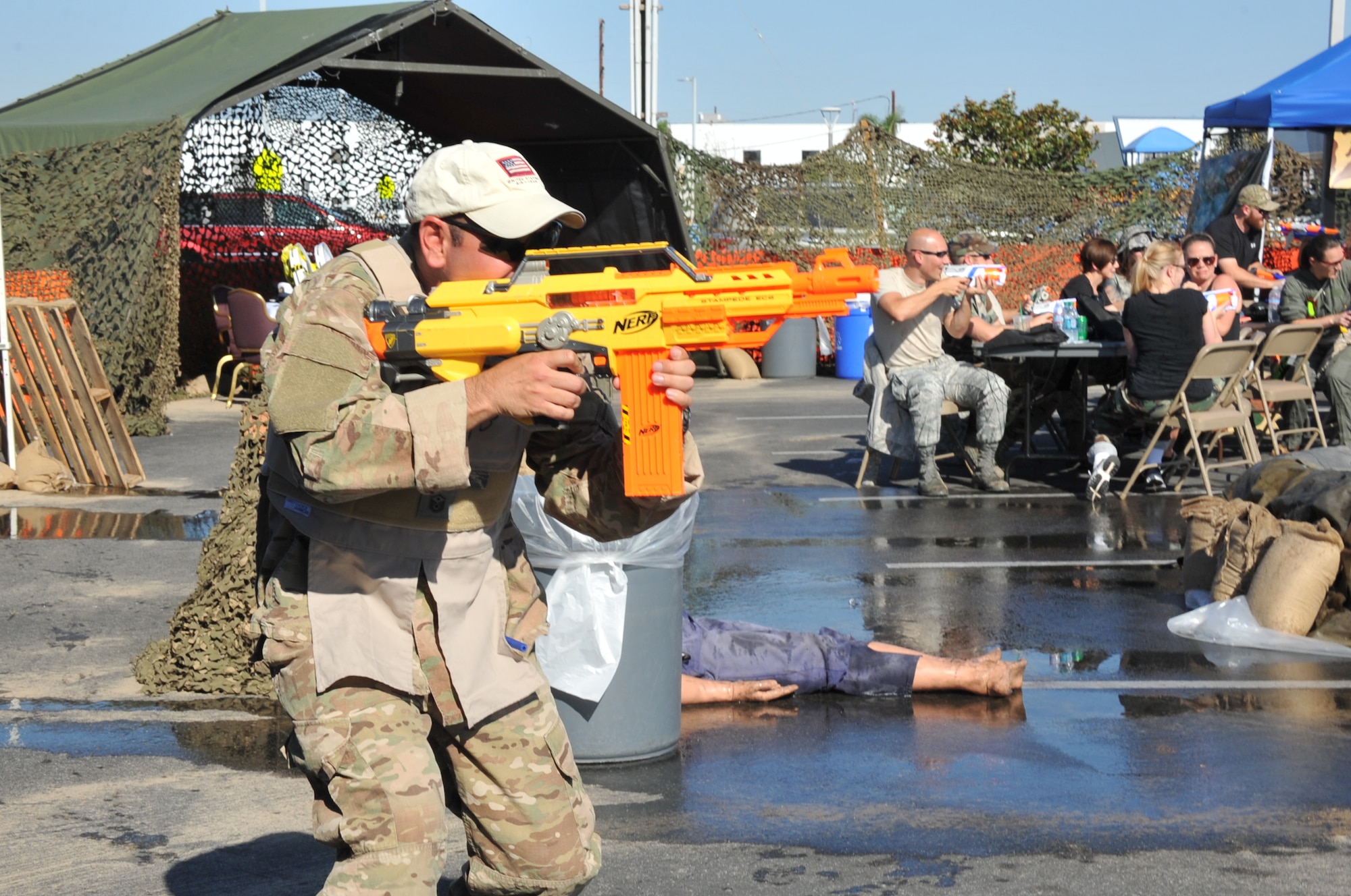 Senior Master Sgt. Steven Shulski, Space and Missile Systems Center 1st Sergeant draws a bead on an opponent during a mock Code Red firefight during the SMC Dining-Out held at Los Angeles Air Force Base in El Segundo, Calif. (U.S. Air Force photo/Sarah Corrice)