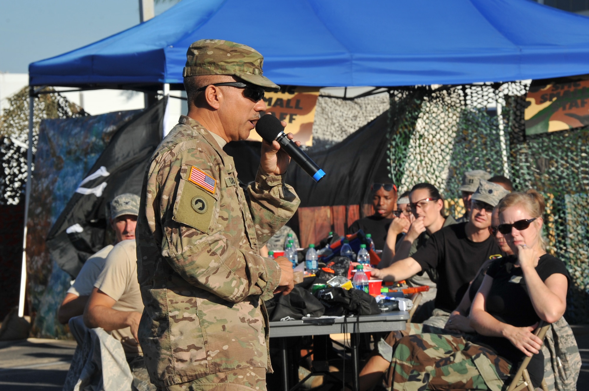Guest speaker and California National Guard Command Sgt. Maj. Ron Cabrera addresses the Warriors of the Mess, reflecting on their service in the past while offering personal thanks to the attendees for serving their country during the Space and Missile Systems Center Dining-Out held at Los Angeles Air Force Base in El Segundo, Calif. (U.S. Air Force photo/Sarah Corrice)