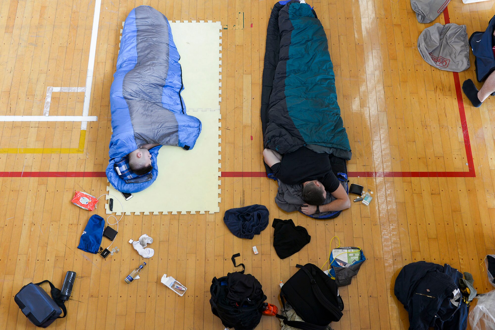 Volunteers with the 374th Civil Engineer Squadron sleep on the gym floor of a local
elementary school at Kanuma City, Tochigi prefecture, Japan, Sept. 15, 2015. More than
20 of 60 volunteers stayed in the elementary's gym for two nights while assisting in flood
relief efforts in the Tochigi area. (U.S. Air Force photo by Staff Sgt. Cody H. Ramirez/
Released)