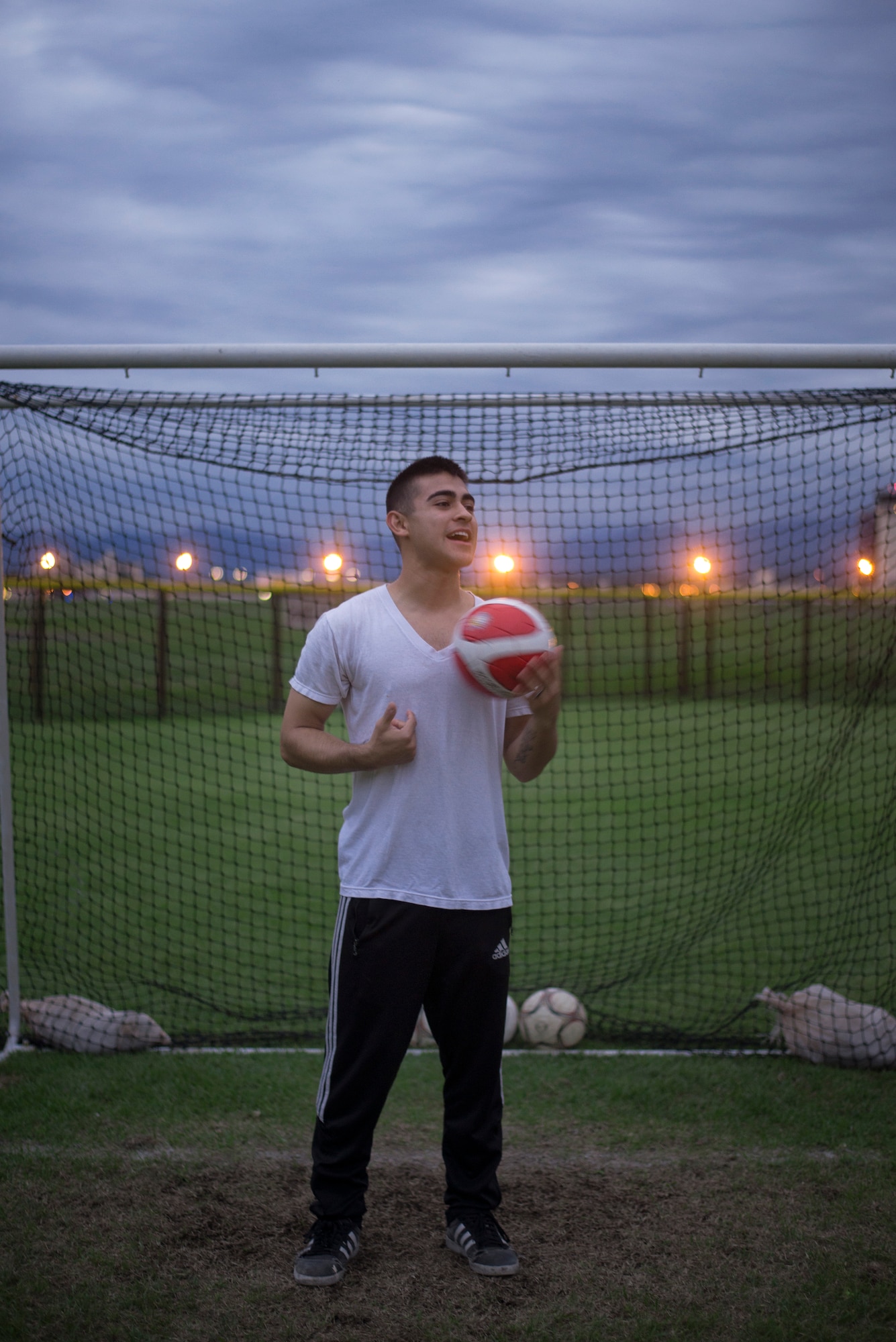 Airman 1st Class Tomasz Barba, volunteer soccer coach, handles a soccer ball at Yokota Air Base, Japan, Sept. 15, 2015. Barba said that he’s benefited from coaching as it allowed him to revisit and reinforce his own fundamentals. (U.S. Air Force photo by Airman 1st Class Delano Scott/Released)