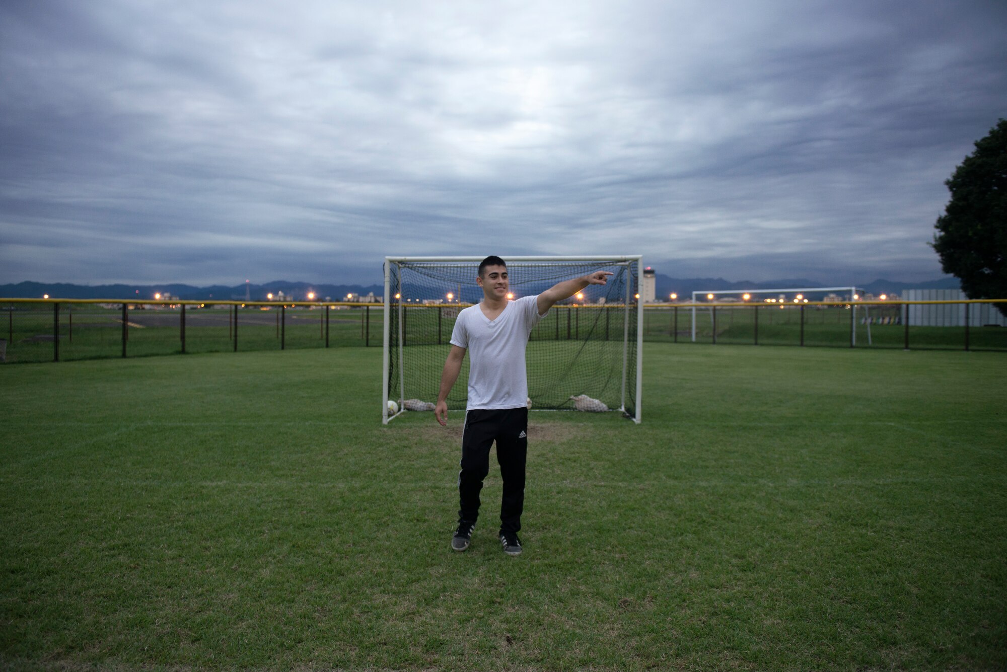 Airman 1st Class Tomasz Barba, volunteer soccer coach, initiates a scrimmage for his players at Yokota Air Base, Japan, Sept. 15, 2015. Barba ends practice with a scrimmage to give players an opportunity to utilize the skills they learn and apply them to the upcoming game. (U.S. Air Force photo by Airman 1st Class Delano Scott/Released)