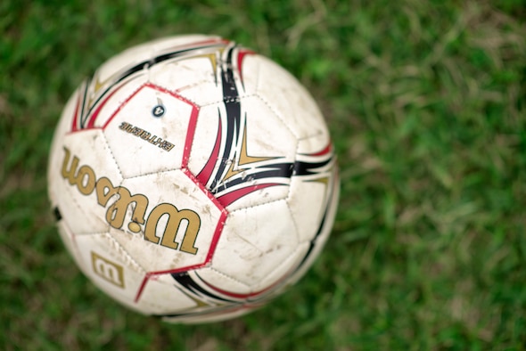 A soccer ball lays on a field at Yokota Air Base, Japan, Sept. 15, 2015. Participants of Yokota’s youth soccer program are given a chance to develop their skill in a fun and safe environment. (U.S. Air Force photo by Airman 1st Class Delano Scott/Released)