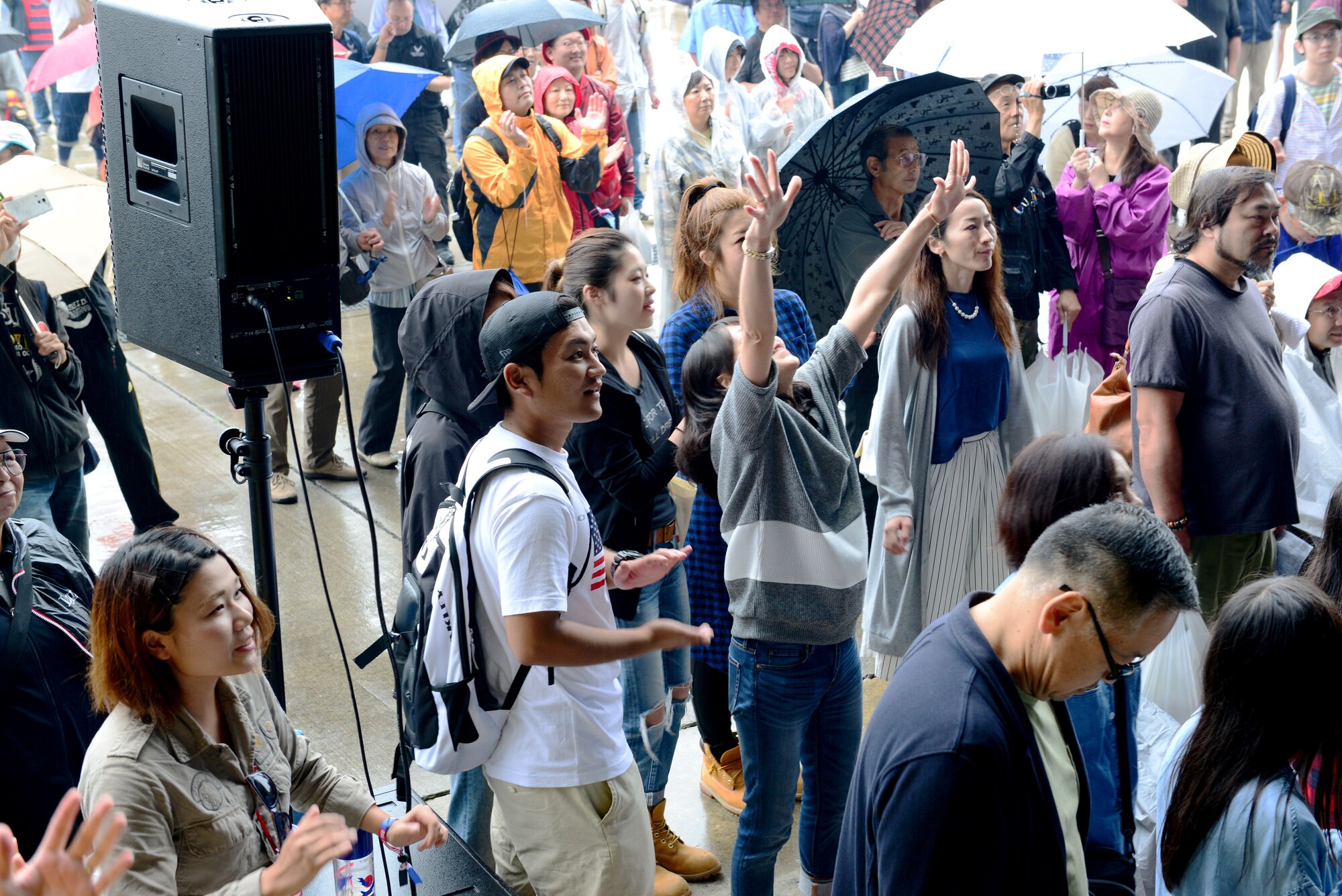 Spectators dance while the Pacific Air Forces Band Pacific Trends play music at the Misawa Air Festival Sept. 13, 2015. More than 100,000 people attended the festival which showcased more than 30 static displays, aerial demonstrations, local and American food booths, and live music. (U.S. Air Force photo by Tech. Sgt. Melissa Mekpongsatorn/Released)