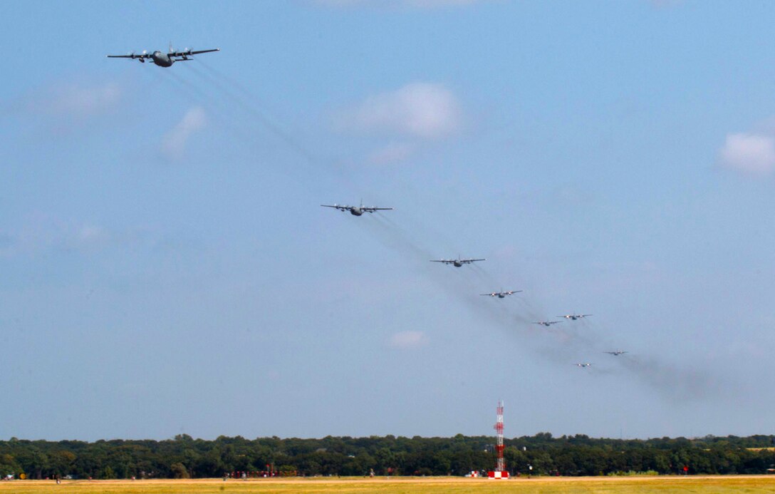 Eight C-130H2 aircrafts fly over Naval Air Station Fort Worth Joint Reserve Base, Texas, during a mass formation mission using all aircrafts assigned to the 136th Airlift Wing, Texas Air National Guard. The last time this feat was accomplished was in 1991, when all eight aircraft flew in mass formation over Naval Air Station Dallas. (Air Force photo by Master Sgt. Joshua Woods/released)