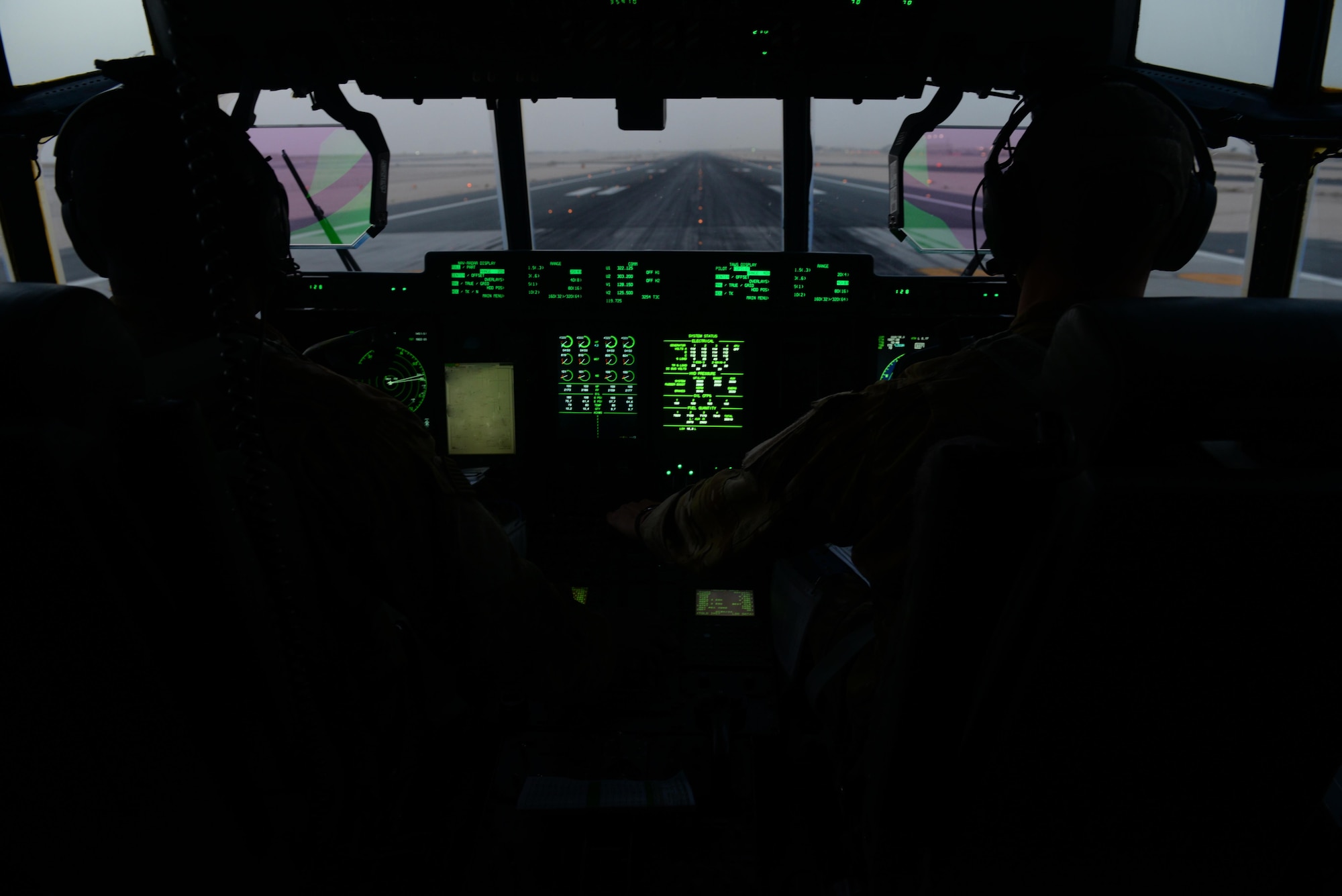 U.S. Air Force Capt.’s Boston McClain and Matt Buchholtz, 774th Expeditionary Airlift Squadron C-130J Super Hercules pilots, take-off for Bagram Airfield, Afghanistan, Sep. 3 2015, at Al Udeid Air Base, Qatar. The pilots, who are deployed from Little Rock Air Force Base, Arkansas, fly various combat missions throughout Afghanistan supporting missions ranging from medical evacuations to cargo and passenger transports. (U.S. Air Force photo by Senior Airman Cierra Presentado/Released)