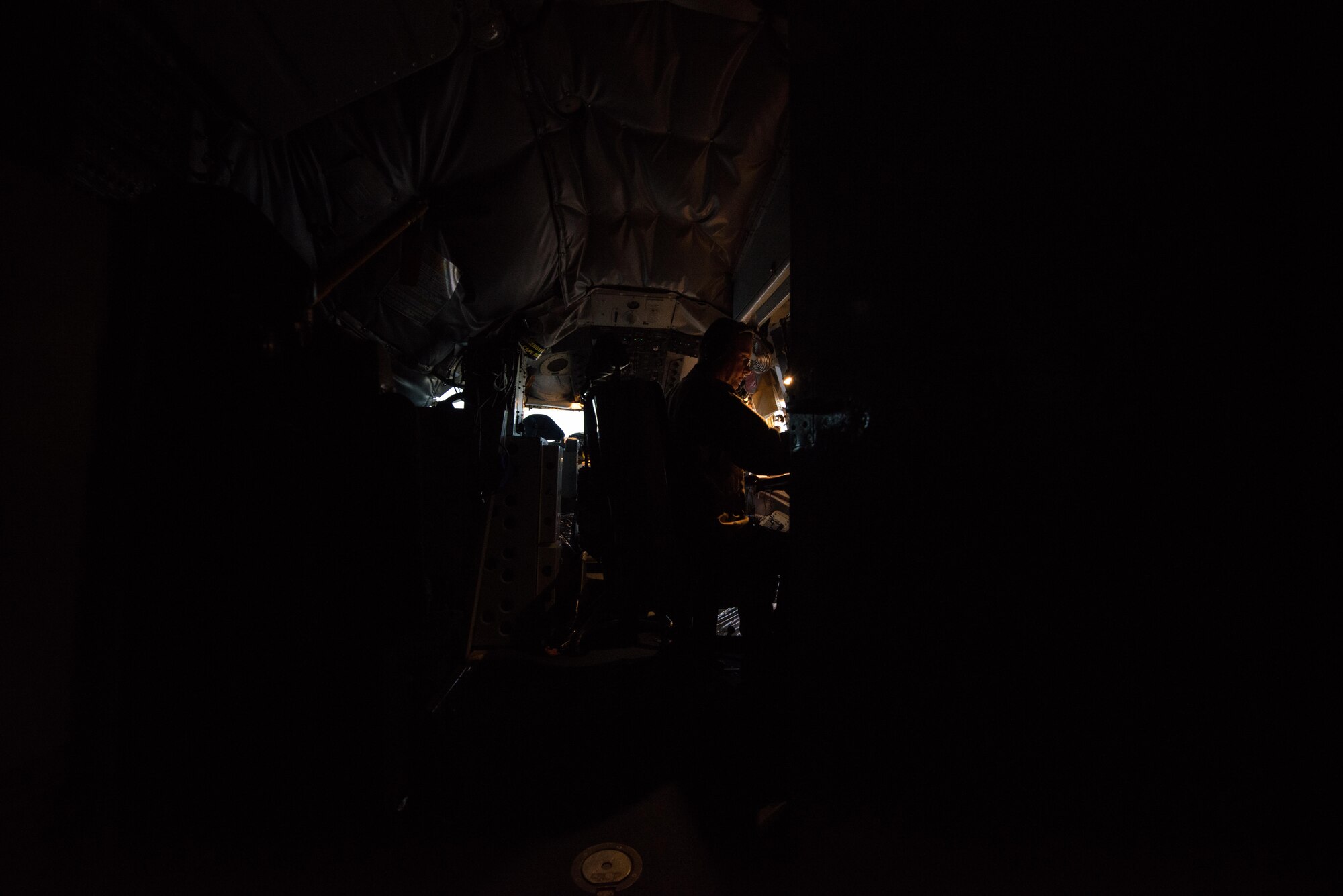 Senior Master Sgt.  Barry, 340th Expeditionary Air Refueling Squadron boom operator, calculates the final amount of fuel given to U.S. and coalition aircraft in support of OPERATION INHERENT RESOLVE September 16, 2015. (U.S. Air Force photo/Staff Sgt. Alexandre Montes)  