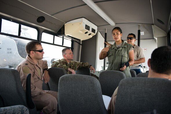 Senior Airman Rosina McGlothlin and Edwin Carvajal, 340th Aircraft Maintenance Unit, brief a KC-135 Stratotanker aircrew about the aircraft’s performance prior to final inspections for a sortie September 16, 2015 at Al Udeid Air Base, Qatar. (U.S. Air Force photo/Staff Sgt. Alexandre Montes)