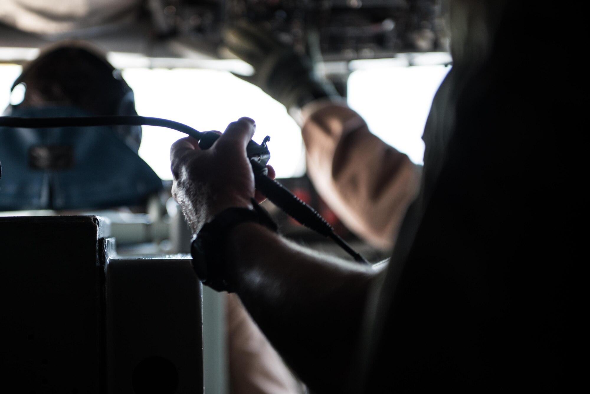 Senior Master Sgt.  Barry, 340th Expeditionary Air Refueling Squadron boom operator, communicates with the pilots of a KC-135 Stratotanker during pre-flight checklist completion September 16, 2015 at Al Udeid Air Base, Qatar. (U.S. Air Force photo/Staff Sgt. Alexandre Montes)