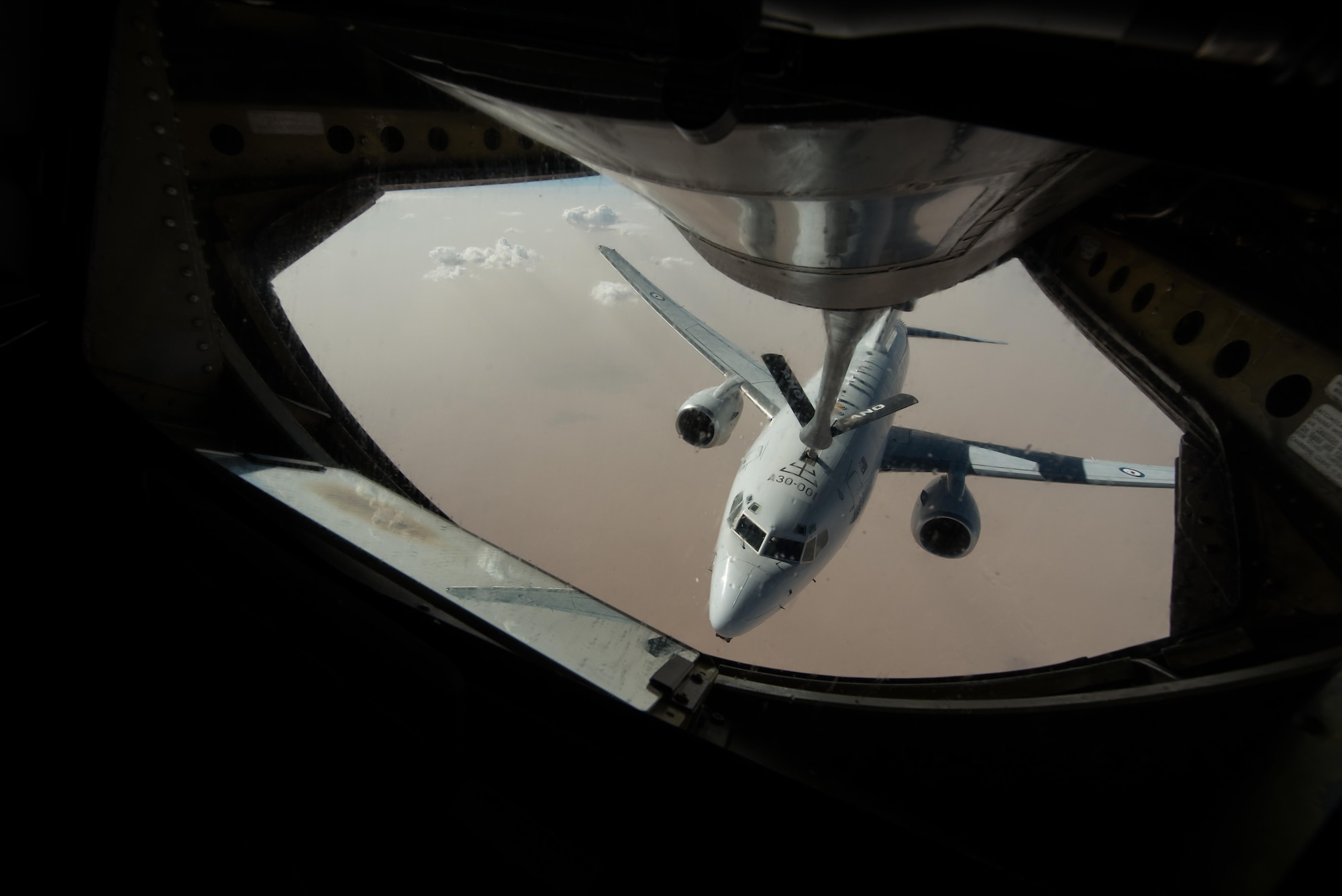 A Royal Australian Air Force E-7A Wedgetail receives fuel from an Air National Guard KC-135 Stratotanker that is deployed to the 340th Expeditionary Air Refueling Squadron at Al Udeid Air Base, Qatar over Iraq September 16, 2015. (U.S. Air Force photo/Staff Sgt. Alexandre Montes)  