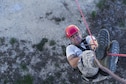 Senior Airman Christian Torres, a 502nd Civil Engineer Squadron firefighter, performs an inversion technique during the repelling demonstration portion of the 2015 Battle of the Badges Sept. 12, 2015, at the Joint Base San Antonio- Randolph, Texas. This year’s Battle of the Badges  included three main events for time: a tactical shooting challenge, a firefighter combat challenge, and a fire truck pull. In addition to the traditional challenges, this year’s event gave both defenders and firefighters the opportunity to showcase parts of their missions with repelling, military working dogs and Taser demonstrations. (U.S. Air Force Photo/Senior Airman Alexandria Slade)