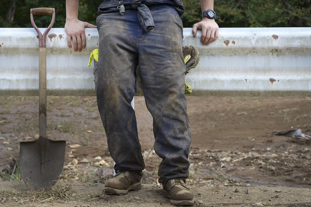 A volunteer rests after a day of work removing mud and debris from a clogged irrigation drain at Kanuma City, Tochigi prefecture, Japan, Sept. 15, 2015. U.S. Air Force photo by Staff Sgt. Cody H. Ramirez 