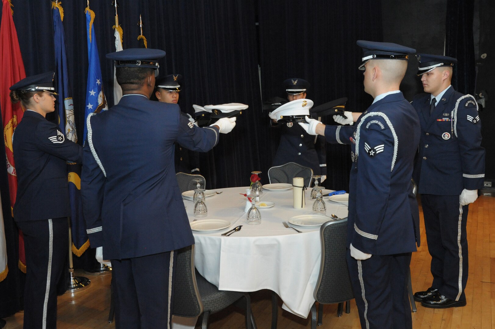 Members of the Joint Base San Antonio honor guard perform the missing man ceremony during the prisoners of war and missing in action day breakfast Sept. 15, 2015 at Joint Base San Antonio-Randolph.  Each year JBSA holds events honoring POW/MIA’s including the POW/MIA breakfast, 5k run, retreat ceremony and an observes on National Prisoner of War and Missing in Action Day. 