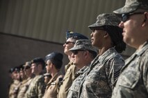 Combined Air Operations Center members stand in formation during the French National Day Parade September 14, 2015 at Al Udeid Air Base, Qatar. The parade was the commemoration of the death of WWI French pilot Capt. Georges Guynemer, in Polkapelle, on September 11th, 1917. Since 1923, the French Air Force has organized a parade to start or close the day in remembrance of him.  (U.S. Air Force photo by Tech. Sgt. Rasheen Douglas)