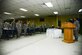 Airmen in the Independence Dining Facility stand at attention singing the Air Force Song during the cake cutting ceremony Sept. 18, 2015, at Al Udeid Air Base, Qatar. The cake cutting ceremony is traditionally performed by the oldest and youngest Airman. This year marks 68 years of military superiority through air power. (U.S. Air Force photo by Tech. Sgt. Rasheen Douglas)