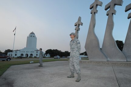 Master Sgt. Dennis Derwacter (left), and Master Sgt. Claudette Wright, Air Force Personnel Operations Agency, prepare to replace Staff Sgt. Heather King (right), Air Force Personnel Center, and Staff Sgt. Peter Rivera, Air Force Recruiting Service, and stand watch over the Missing Man Monument Sept. 18, 2015 at Joint Base San Antonio-Randolph.  The Missing Man monument guard detail caps off a week long homage to POWs and MIAs that also included a POW/MIA breakfast, remembrance run and a retreat ceremony. (U.S. Air Force photo by Joel Martinez/Released)