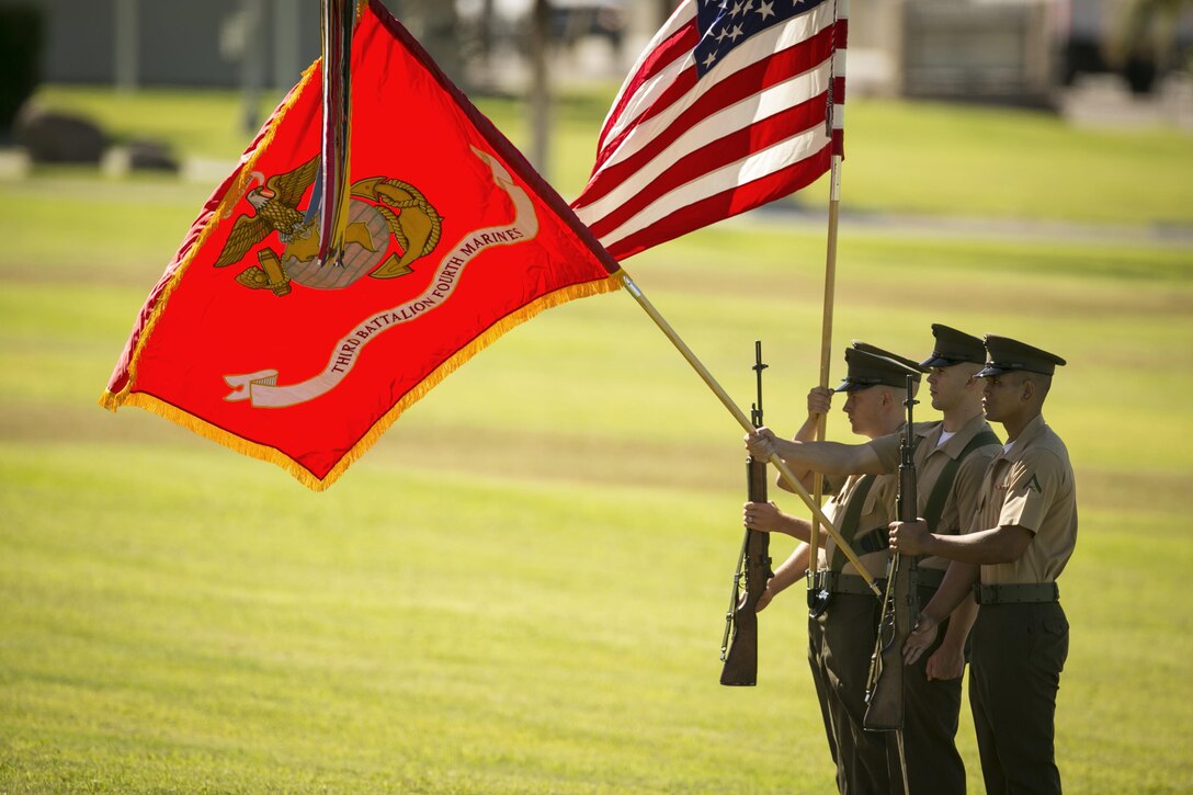 The 3rd Battalion, 4th Marines, 7th Marine Regiment Color Guard presents the colors for the playing of the national anthem as part of the battalion’s reactivation ceremony at Lance Cpl. Torrey L. Gray Field, Sept. 17, 2015.