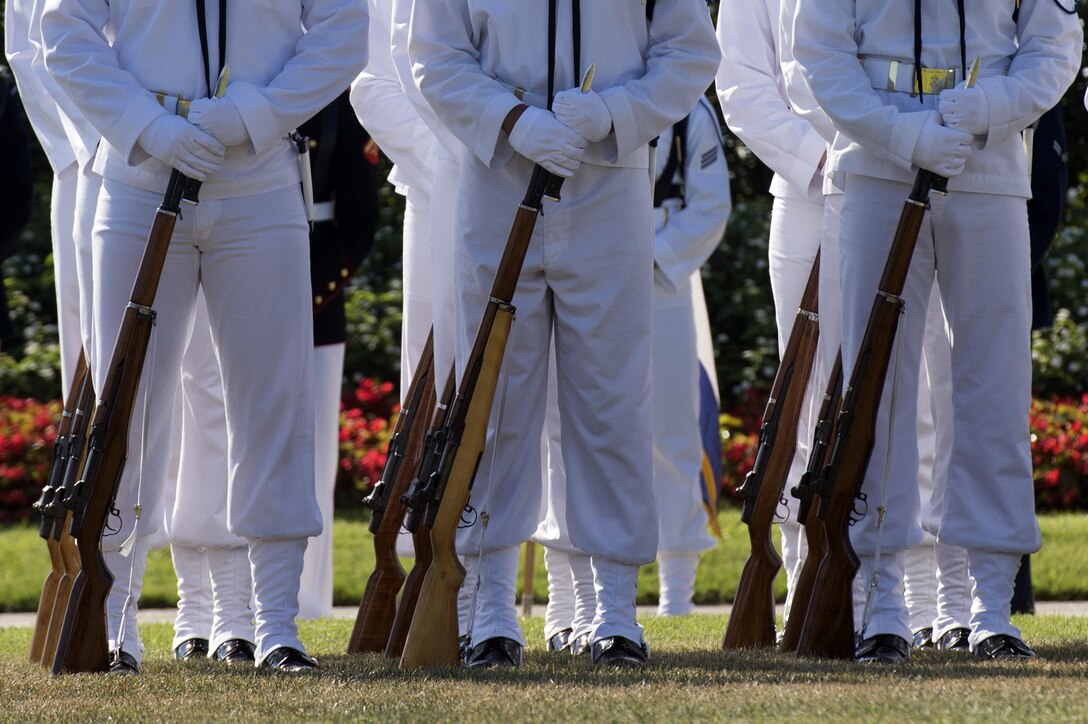 A Navy honor guard stands at ease as Defense Secretary Ash Carter delivers remarks at the Prisoner of War, Missing in Action National Recognition Day ceremony at the Pentagon, Sept. 18, 2015. 