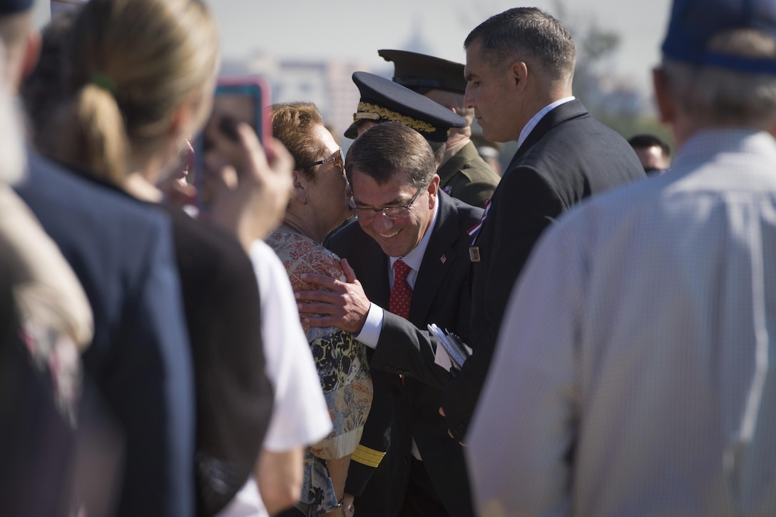 Defense Secretary Ash Carter speaks with guests following the Prisoner of War, Missing in Action National Recognition Day ceremony at the Pentagon, Sept. 18. 
