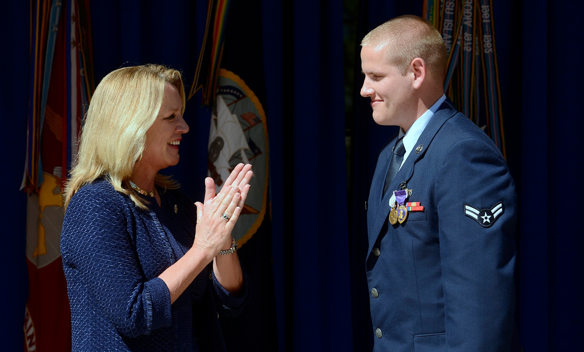 Secretary of the Air Force Deborah Lee James congratulates Airman 1st Class Spencer Stone at the Heroes of the Rails ceremony at the Pentagon in Washington, D.C., Sept. 17, 2015. Stone was awarded the Airman’s Medal and the Purple Heart for bravery and valor during his heroic actions on the train bound for Paris. (U.S. Air Force photo/Scott Ash)                                                                                               