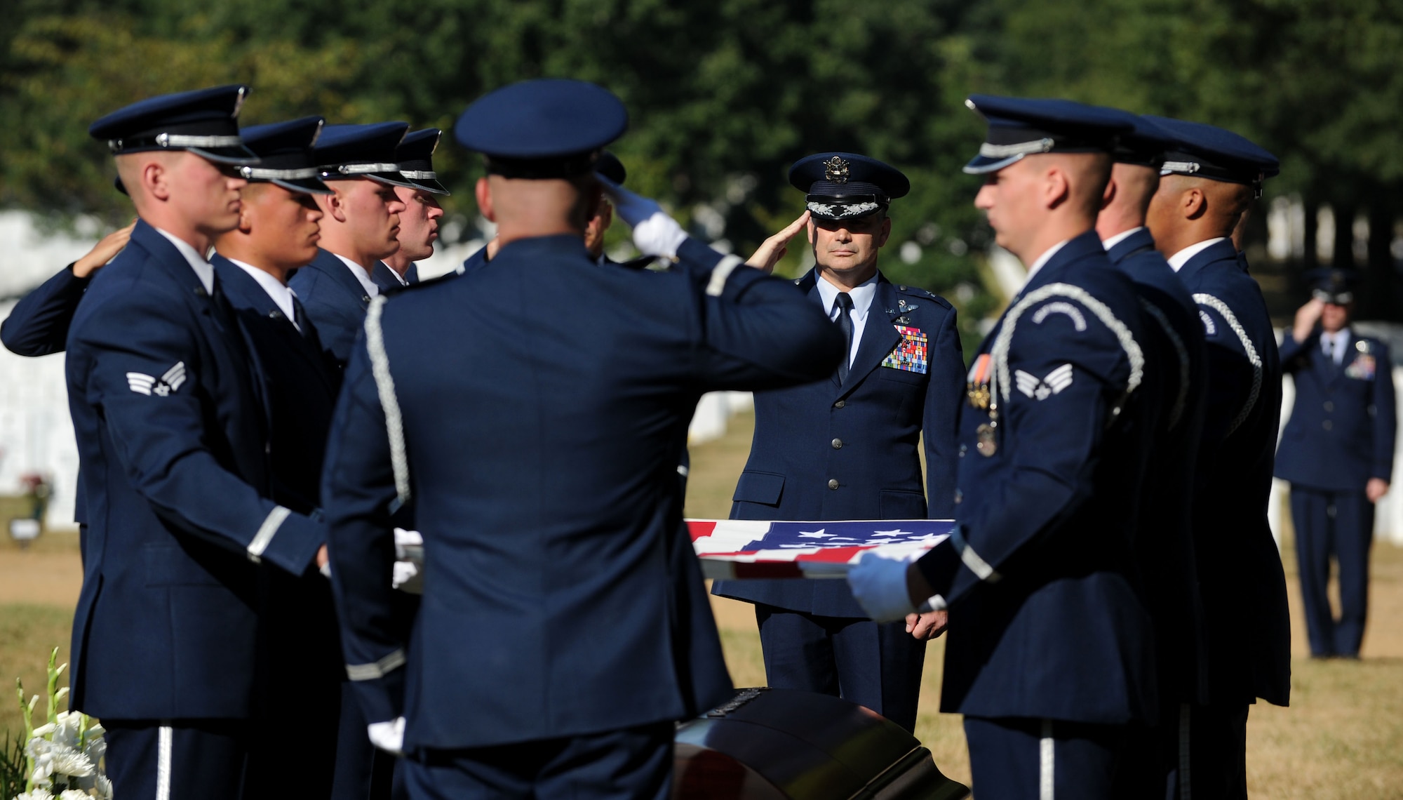 The Air Force Honor Guard folds the flag that was draped over Capt. Matthew Roland’s casket at Arlington National Cemetery, Va., Sept. 18, 2015. The flag was present to Roland’s parents. Roland was fatally wounded in an attack at a vehicle checkpoint at Camp Antonik, a forward operating base in Helmand Province, Afghanistan. Roland was a special tactics officer at the 23rd Special Tactics Squadron, Hurlburt Field, Fla. (U.S. Air Force photo/ Staff Sgt. Nichelle Anderson)