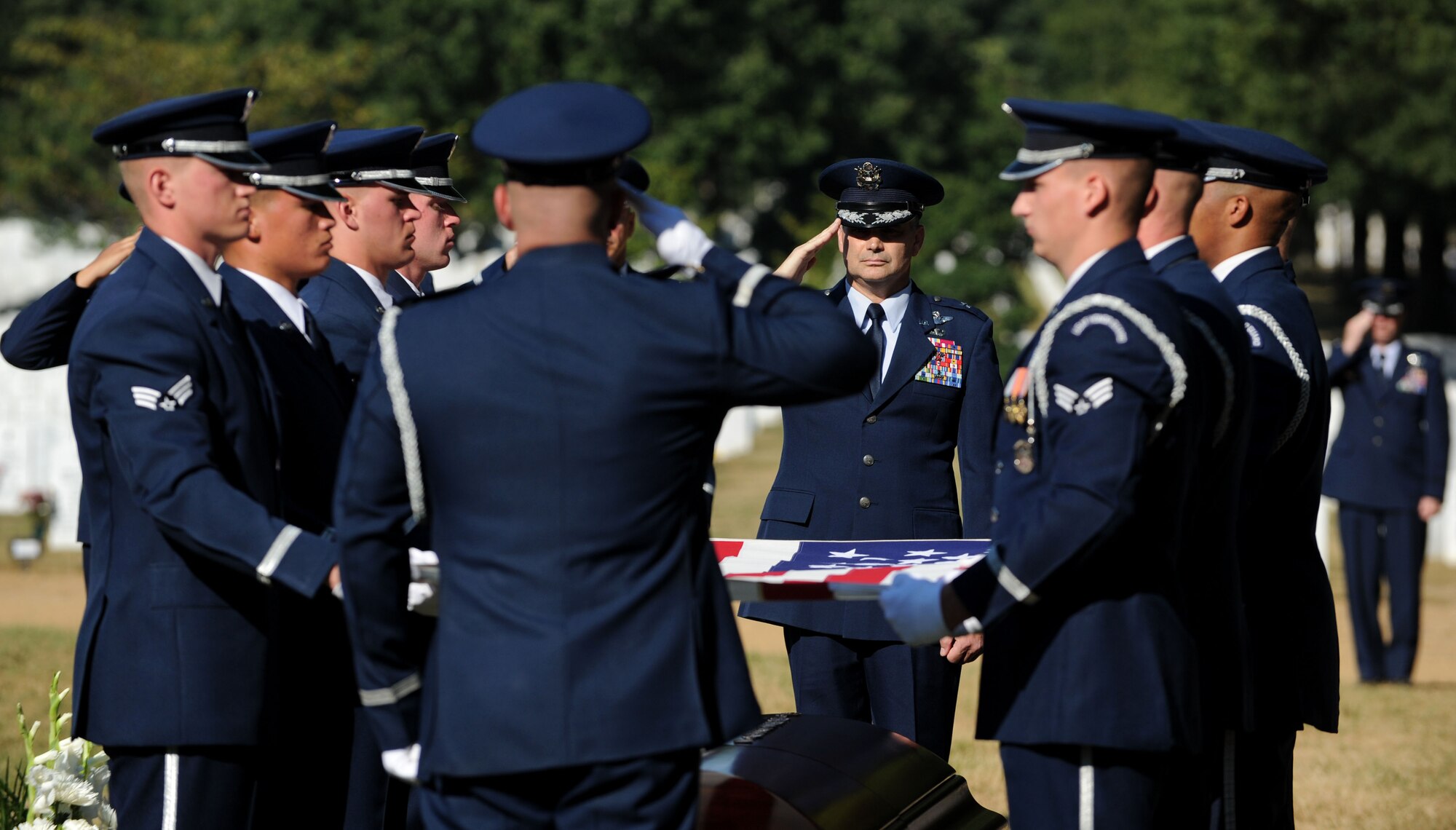 The Air Force Honor Guard folds the flag that was draped over Capt. Matthew Roland’s casket at Arlington National Cemetery, Va., Sept. 18, 2015. The flag was present to Roland’s parents. Roland was fatally wounded in an attack at a vehicle checkpoint at Camp Antonik, a forward operating base in Helmand Province, Afghanistan. Roland was a special tactics officer at the 23rd Special Tactics Squadron, Hurlburt Field, Fla. (U.S. Air Force photo/ Staff Sgt. Nichelle Anderson)