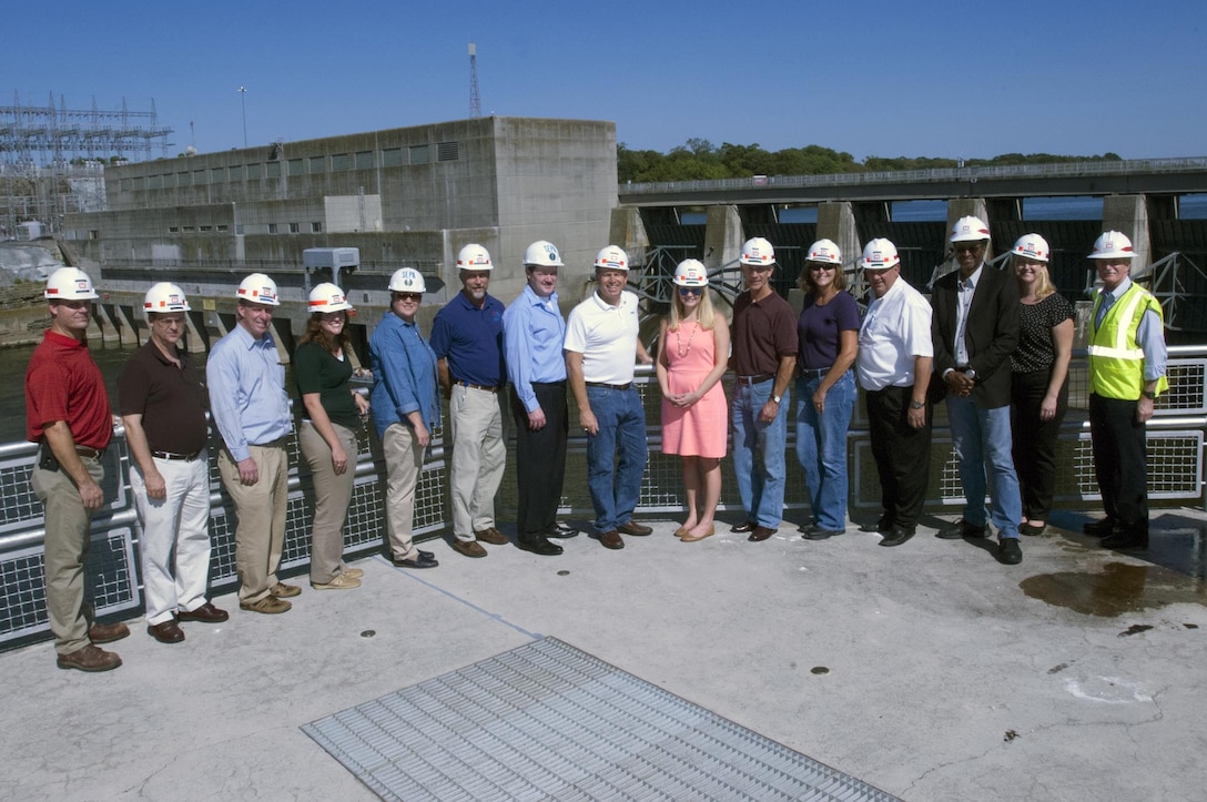 Corps employees and members of Team Cumberland pose with Old Hickory Dam and Power Plant in the background.  Hendersonville, Tenn., Sept. 15, 2015.  Team Cumberland toured the Power Plant in Hendersonville, Tenn., which is operated by the U.S. Army Corps of Engineers Nashville District. (USACE photo by Leon Roberts) 