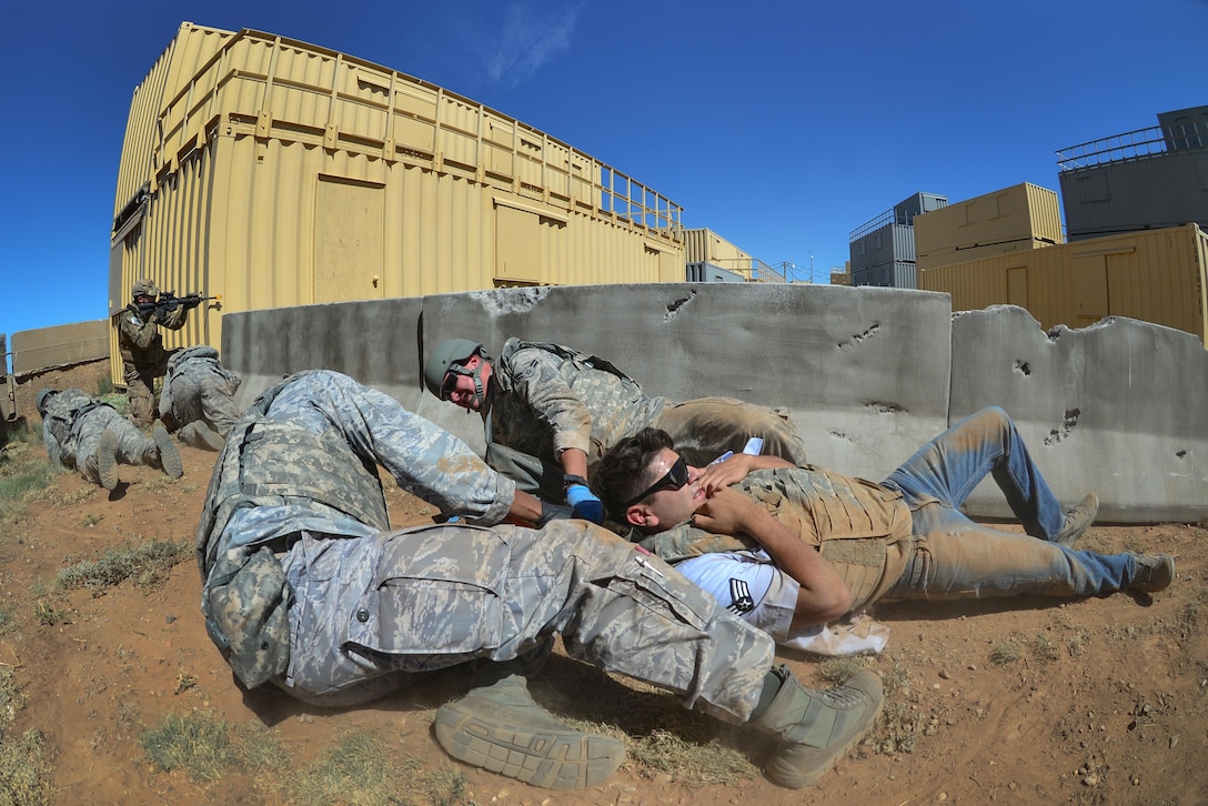 Air Force medics drag a simulated patient to safety at Melrose Air Force Range, west of Cannon Air Force Base, N.M., Sept. 17, 2015. Teams of elite emergency medical technicians from across the Air Force convened at Cannon for four days of competition. U.S. Air Force photo by Airman 1st Class Shelby Kay-Fantozzi