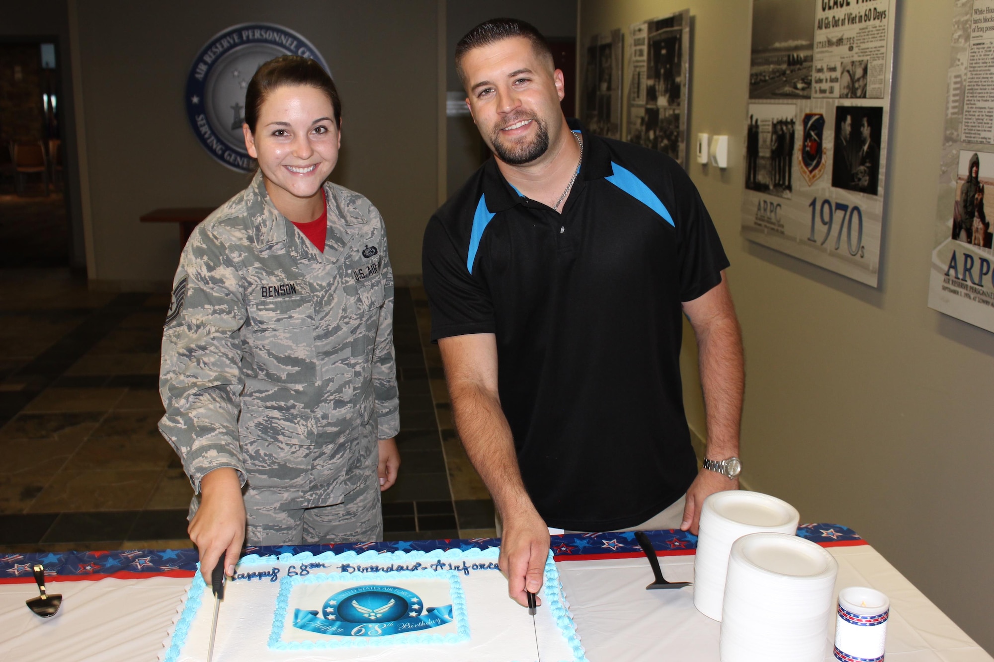Tech. Sgt. Julia Benson, ARPC assistant personnel systems manager, and Kyle Goldberg, ARPC budget systems analyst, cut a ceremonial cake in recognition of the U.S. Air Force’s 68th birthday, Sept. 18, 2015, at the Air Reserve Personnel Center on Buckley Air Force Base, Colo. The Air Force was formed as a separate branch of the military Sept. 18, 1947, under the National Security Act of 1947. (U.S. Air Force photos/Tech. Sgt. Rob Hazelett)