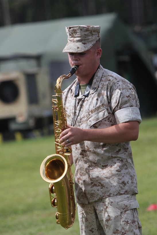 Cpl. Matthew Swigart plays a tenor sax during an open house event at Marine Corps Air Station Cherry Point, N.C., Sept. 18, 2015. Marine Air Control Squadron 2 hosted the event for the spouses and families to help them understand the vital role that they play in their Marines life. During the event families learned about the different aspect s of the Marine Corps to include physical readiness, family readiness and mission readiness. Swigart is a musician with the 2nd Marine Aircraft Wing Band. 