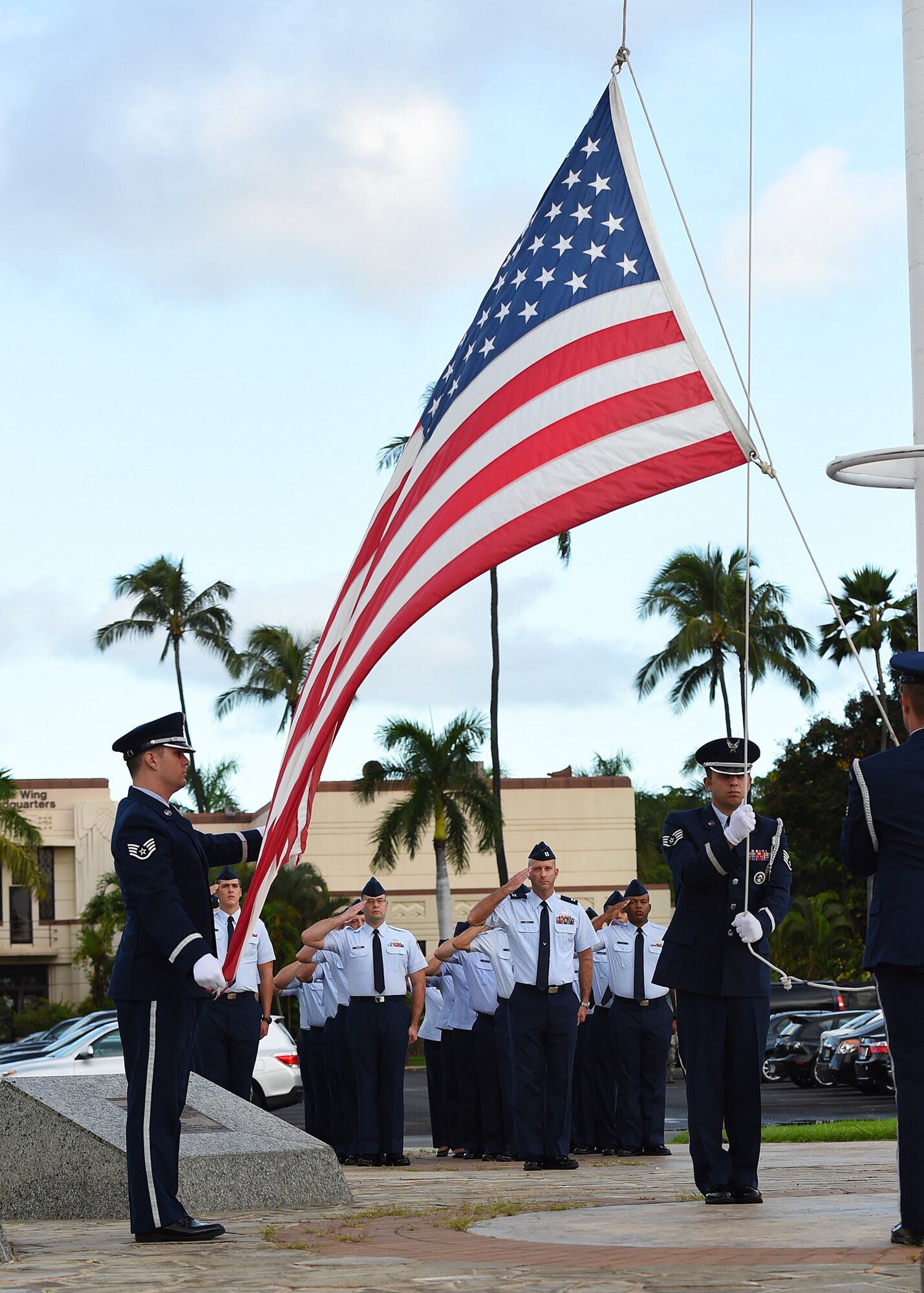 Airmen from Joint Base Pearl Harbor-Hickam’s Air Force Sergeant’s Association salute during a POW/MIA revile ceremony, on JBPHH, Hawaii, Sept. 14, 2015. The ceremony begins this year’s POW/MIA week, which honors the 1,627 missing or unaccounted for military members  in all branches of armed  services. Some of the week’s events will include name readings of those missing or unaccounted for, a remembrance run and a honors and heritage ceremony, held at the Pearl Harbor visitor’s center.  (U.S. Air Force photo by Tech. Sgt. Aaron Oelrich/Released)