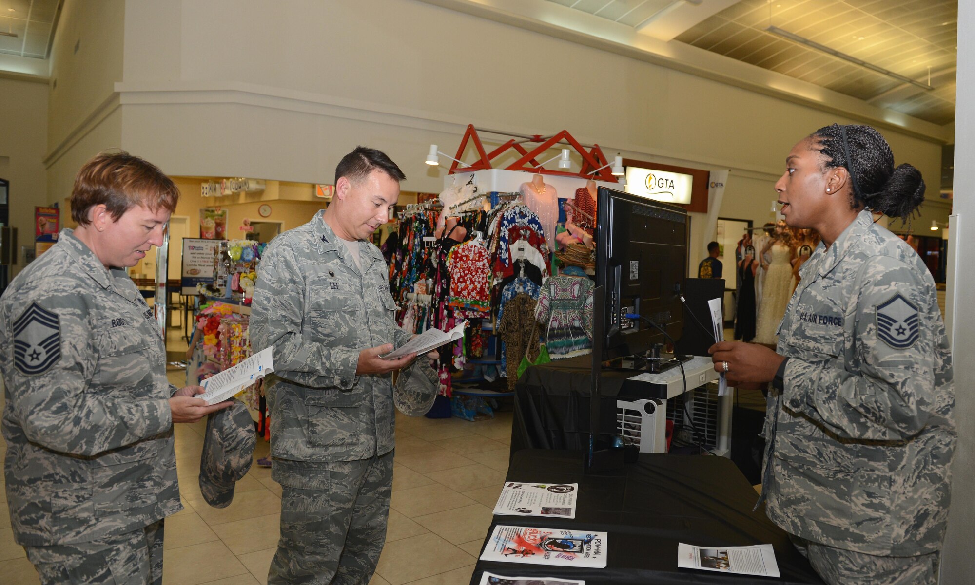 Master Sgt. Rahsha Mitchell, 36th Logistics Readiness Squadron POW/MIA volunteer, informs Col. Daniel Lee (middle), 36th Medical Group commander, and Chief Master Sgt. Michelle Rootes (left), 36th MDG superintendent, Sept. 15, 2015, about the POW/MIA Remembrance Week events at Andersen Air Force Base, Guam. A number of events are scheduled this week including a 5K run, ruck march, golf tournament, vigil run and a retreat ceremony. (U.S. Air Force photo by Airman 1st Class Arielle Vasquez/Released)