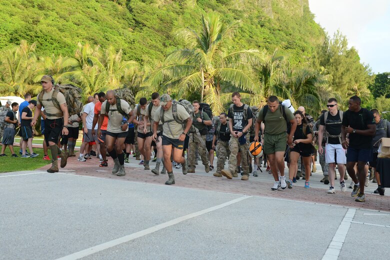 Participants start the race during the POW/MIA memorial ruck march Sept. 16, 2015, at Tarague Beach on Andersen Air Force Base, Guam. Approximately 100 participants attended the ruck march to honor prisoners of war and service members missing in action. (U.S. Air Force photo by Airman 1st Class Arielle Vasquez/Released)
