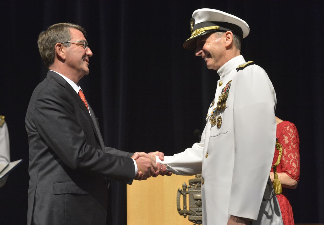 Defense Secretary Ash Carter gives thanks during a change-of-office ceremony at the U.S. Naval Academy in Annapolis, Md., Sept. 18, 2015, as the new chief of naval operations, Adm. John Richardson, replaces Adm. Jonathan Greenert, who is retiring after 40 years of service as a naval officer. DoD photo by Glenn Fawcett 