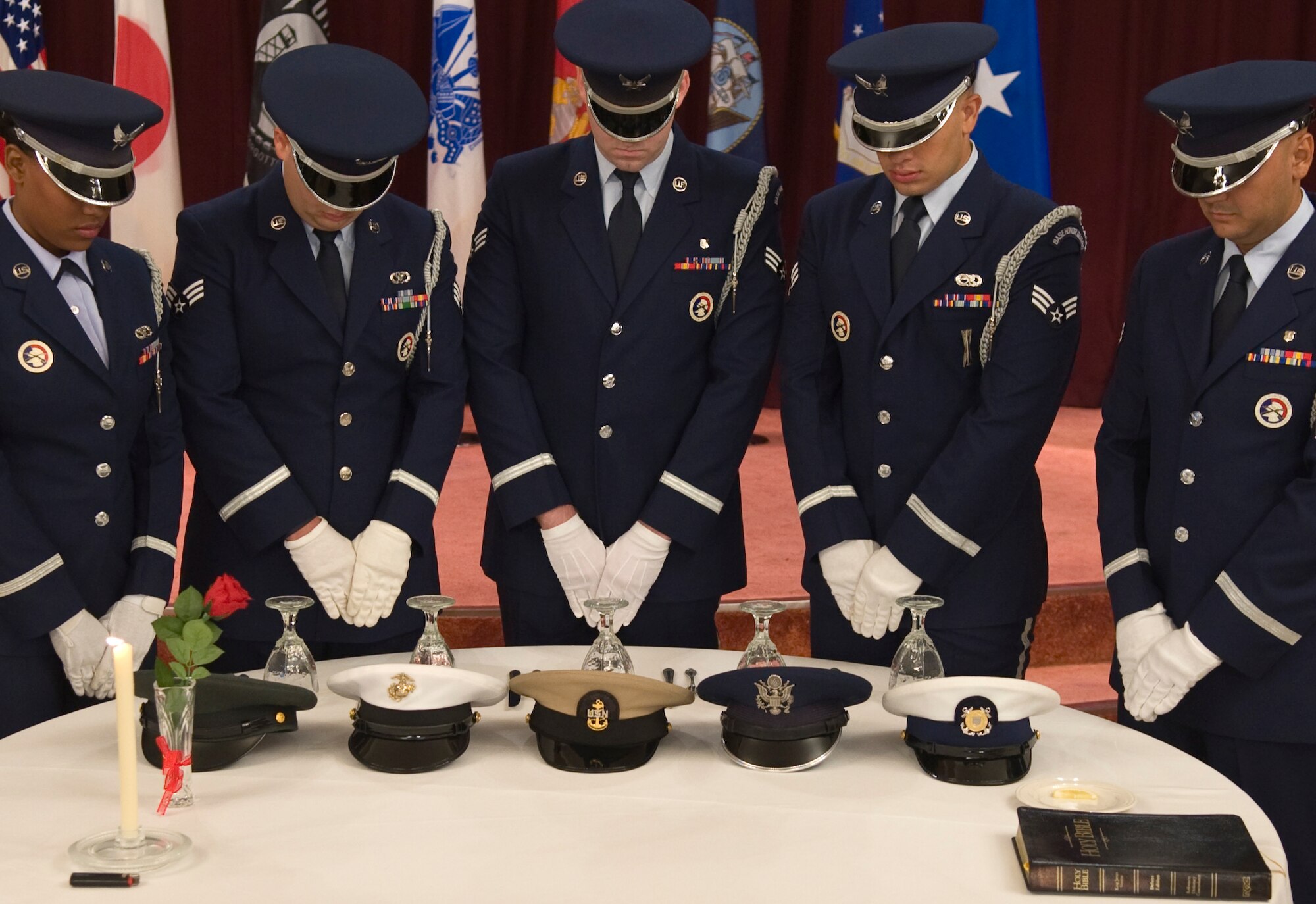Members of Kadena Air Base honor guard conduct a Missing Man Table ceremony Sept. 18, 2015, on Kadena Air Base, Japan. The Missing Man table honors prisoners of war and missing in action service members. (US Air Force photo by Airman 1st Class Nicholas Emerick/Released)