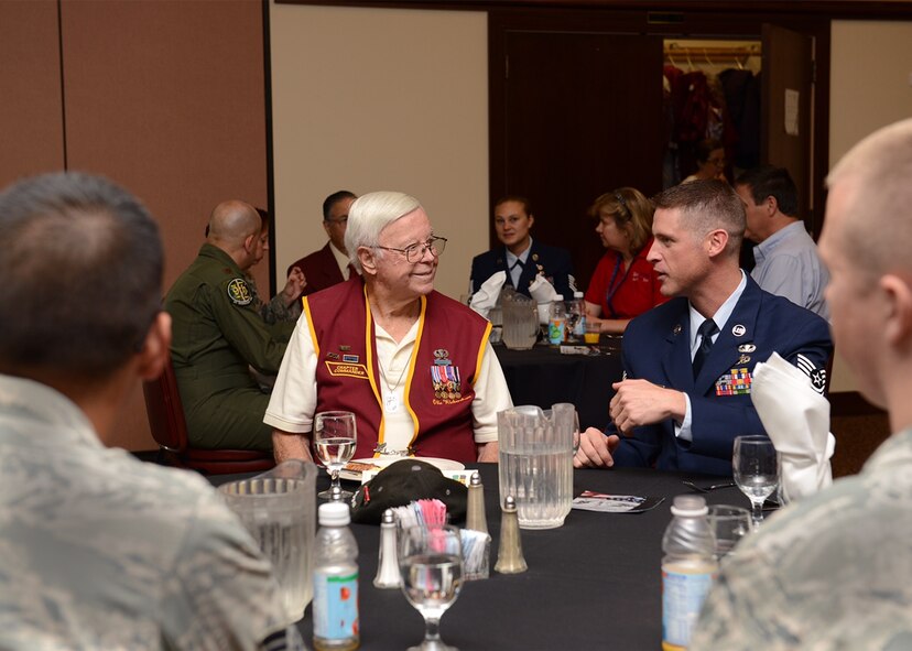 Retired U.S. Army Sgt. 1st Class Obie Wickersham, a World War II veteran and Korean War POW, sits and speaks with Airmen during a National POW/MIA Recognition Day event at Beale Air Force Base, Calif., Sept. 18, 2015. Wickersham was captive for 28 months after Chinese forces overran his platoon May 17, 1951. (U.S. Air Force photo/Chandresh Bhakta)