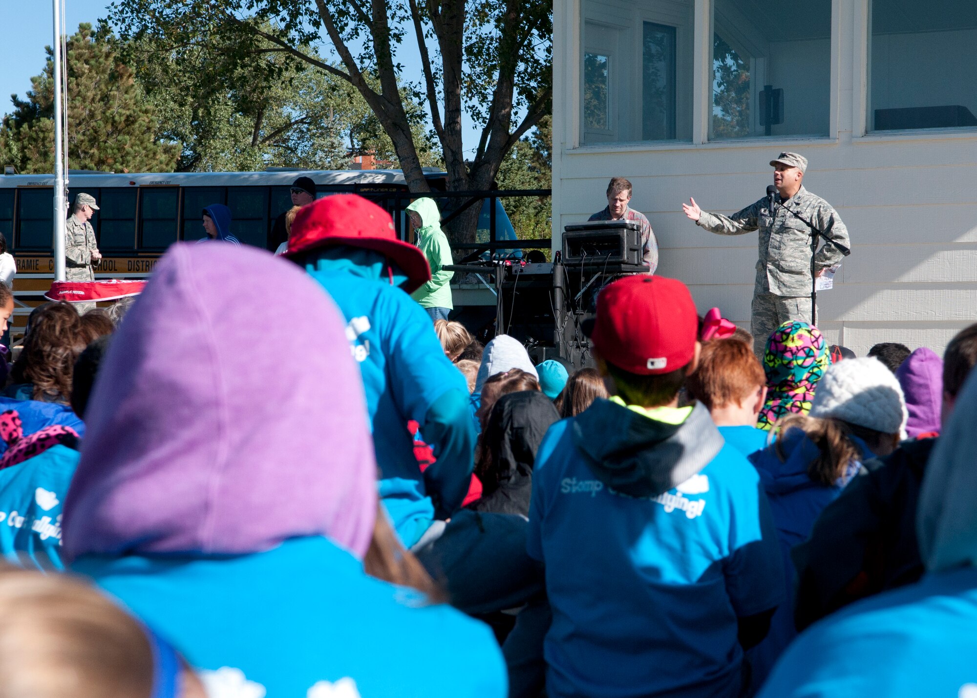 Col. Frank Verdugo, 90th Mission Support Group commander, welcomes children from Freedom Elementary School to the F.E. Warren Air Force Base Argonne Parade Field during the Olweus 2015/16 Anti-bullying Kick-off Fun Run Sept. 18, 2015. The event was held on base due to the collaboration between the 90th MSG and Freedom Elementary. (U.S. Air Force photo by Airman 1st Class Malcolm Mayfield)
