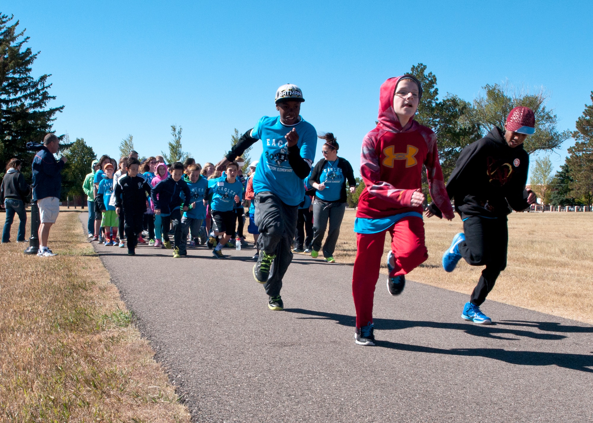 Sixth graders from Freedom Elementary School took off at the start of a quarter –mile run for the Olweus 2015/16 Anti-bullying Kick-off Fun Run on the F.E. Warren Air Force Base Argonne Parade Field. Approximately 360 students, parents, volunteers and staff from the school participated in the event. (U.S. Air Force photo by Airman 1st Class Malcolm Mayfield)