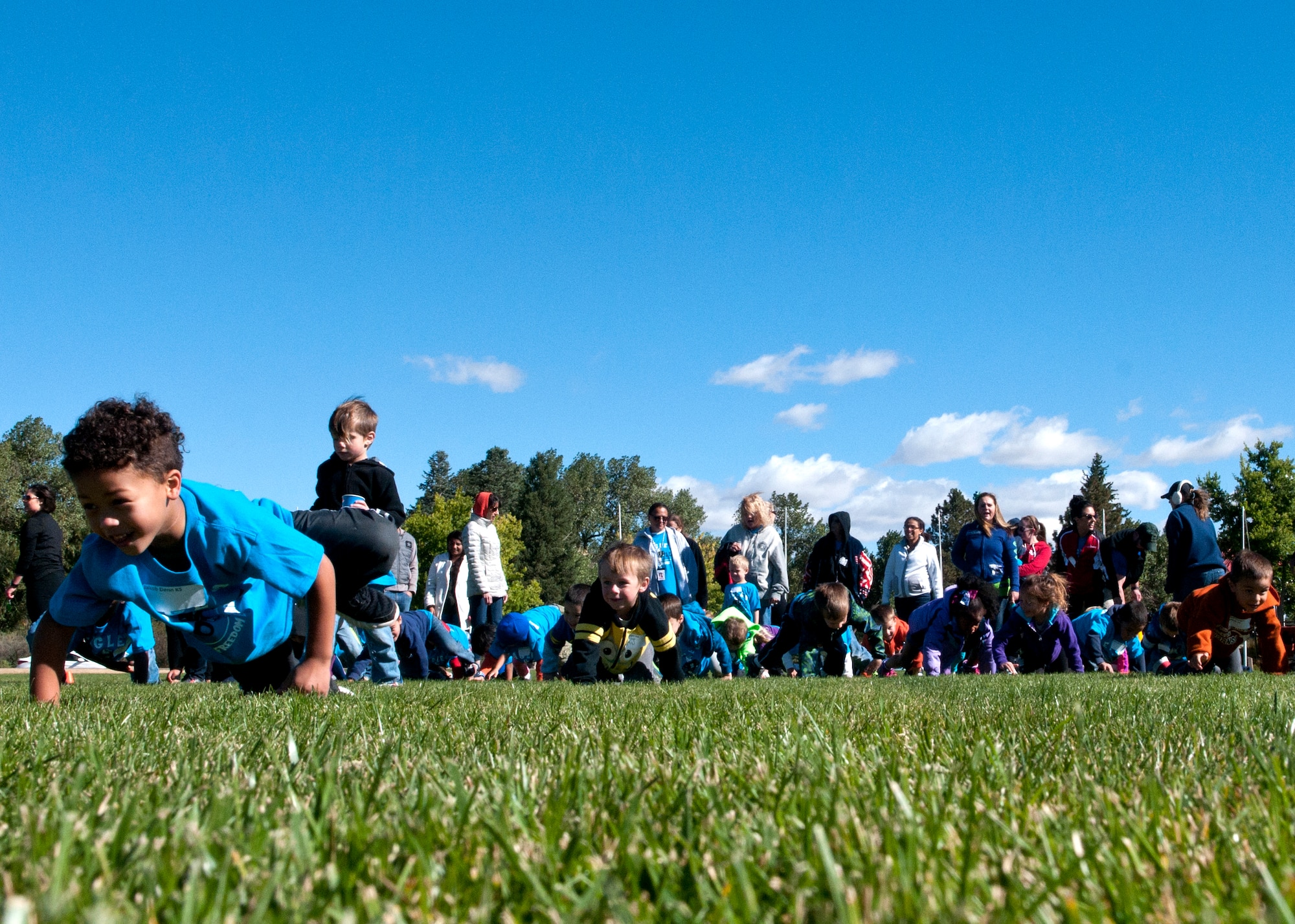 Kindergarten students swarm the F.E. Warren Air Force Base Argonne Parade Field during the Olweus 2015/16 Anti-bullying Kick-off Fun Run on the F.E. Warren Air Force Base Argonne Parade Field. Children from grades K-6 participated in the various activities held on the base. (U.S. Air Force photo by Airman 1st Class Malcolm Mayfield)
