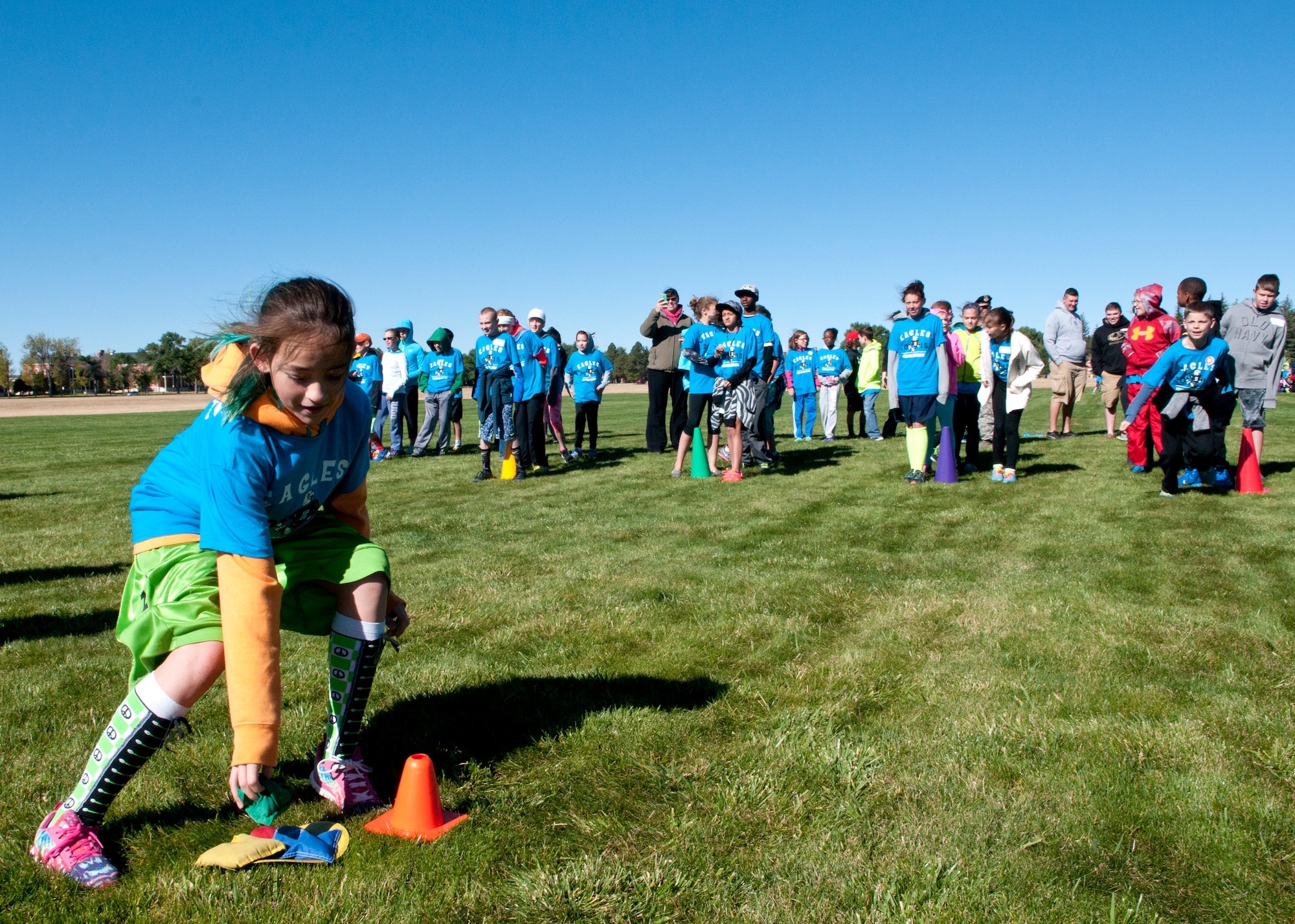 A sixth grader from Freedom Elementary School hurries to finish one of the events of the Olweus 2015/16 Anti-bullying Kick-off Fun Run on the F.E. Warren Air Force Base Argonne Parade Field. Events were setup by base volunteers from the 90th Mission Support Group and Airmen from other organizations. (U.S. Air Force photo by Airman 1st Class Malcolm Mayfield)
