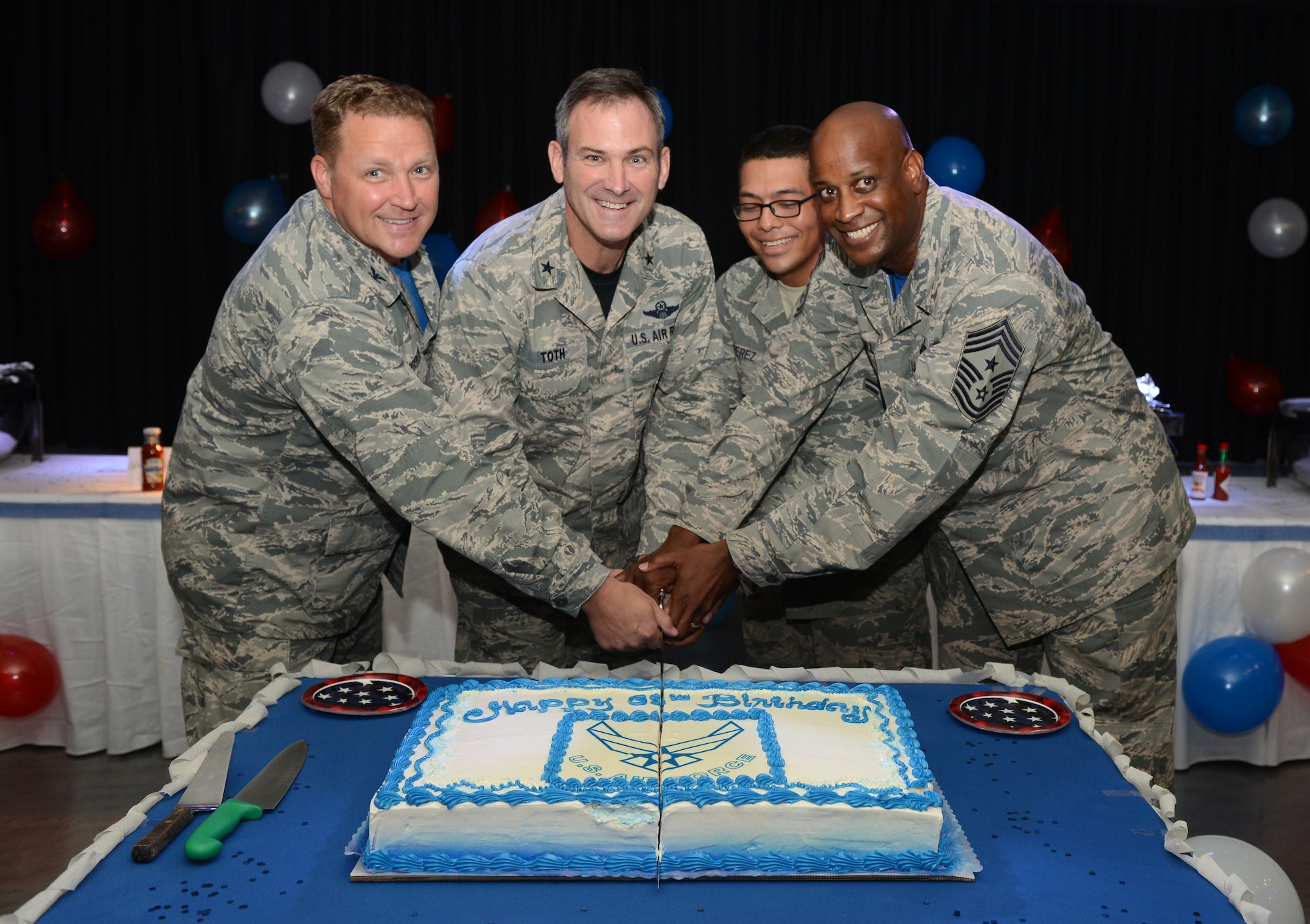 36th Wing leadership cut a cake with Airman 1st Class Mario Perez, 36th Force Support Squadron, during the 68th Air Force birthday celebration at the Top of the Rock dining facility Sept. 18, 2015, on Andersen Air Force Base, Guam. The birthday event celebrated the creation of the U.S. Air Force as an independent service in 1947, when the Air Force separated from the Army Air Forces. (U.S. Air Force photo by Airman 1st Class Arielle Vasquez/Released)