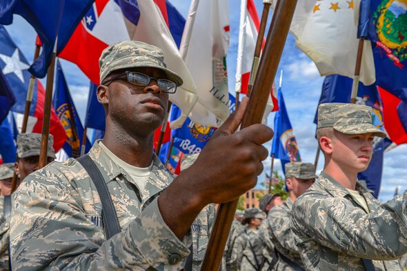 Airmen in Training from Sheppard Air Force Base, Texas, stand at attention for a flag detail during the Prisoners of War and Missing in Action parade at Sheppard Air Force Base, Texas. Sept. 18, 2015. More than 83,000 Americans from World War I all the way through the Gulf War are still considered missing in action. (U.S. Air Force photo/Senior Airman Kyle Gese)